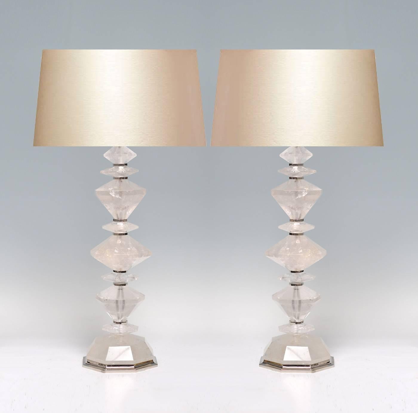 Pair of fine carved diamond form rock crystal lamp quartz lamp with nickel-plating inserts and bases. Available in polish brass and antique brass finished. Created by Phoenix Gallery, NYC.
To the rock crystal: 22