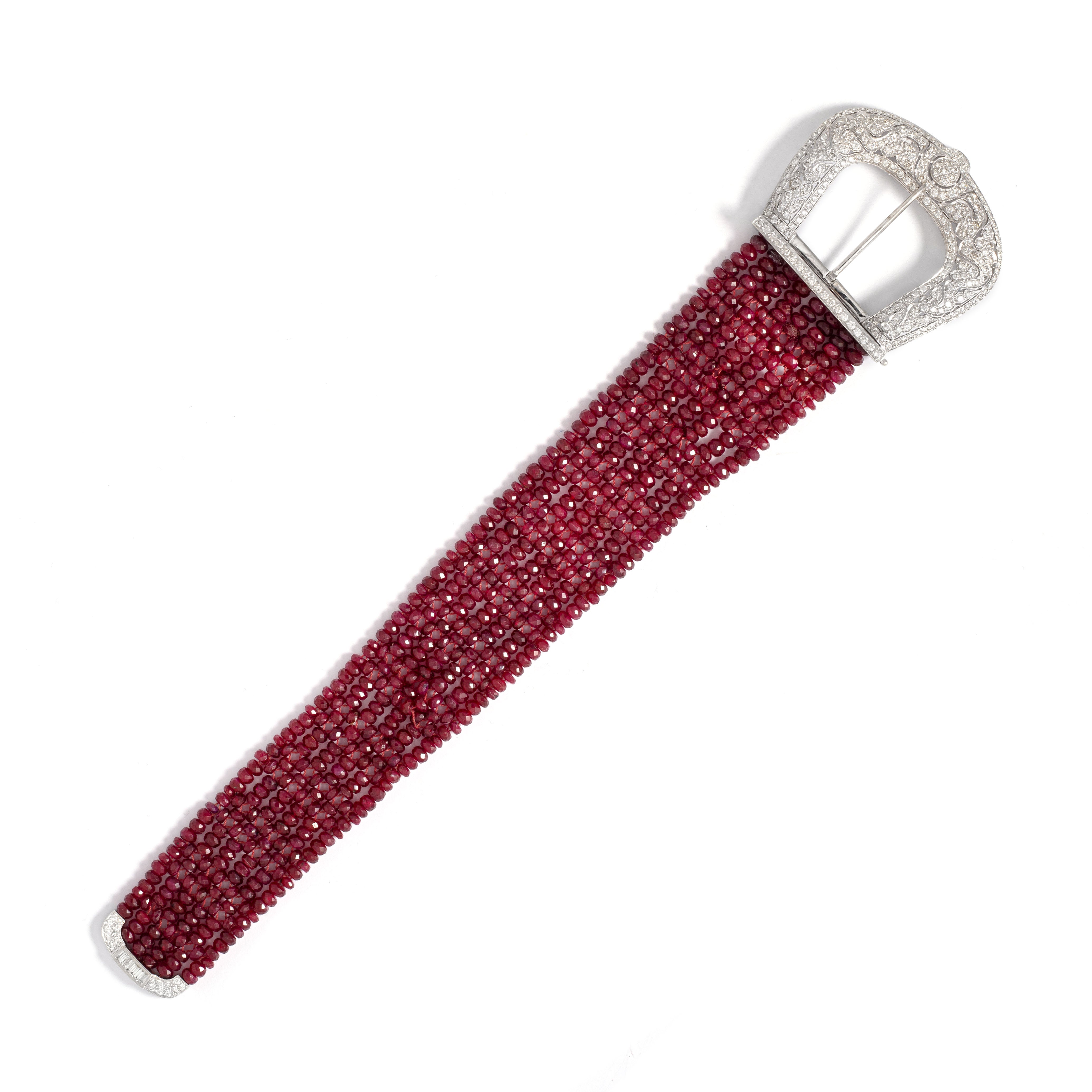 Belle Epoque design pair of diamond bracelets set respectively with rubies and sapphires. 

Ruby Bracelet:
Width: 2.80 up to 5.00 centimeters.
Length: 25.70 centimeters.
Weight: 67.01 grams.

Sapphire Bracelet:
Width: 2.70 up to 5.00