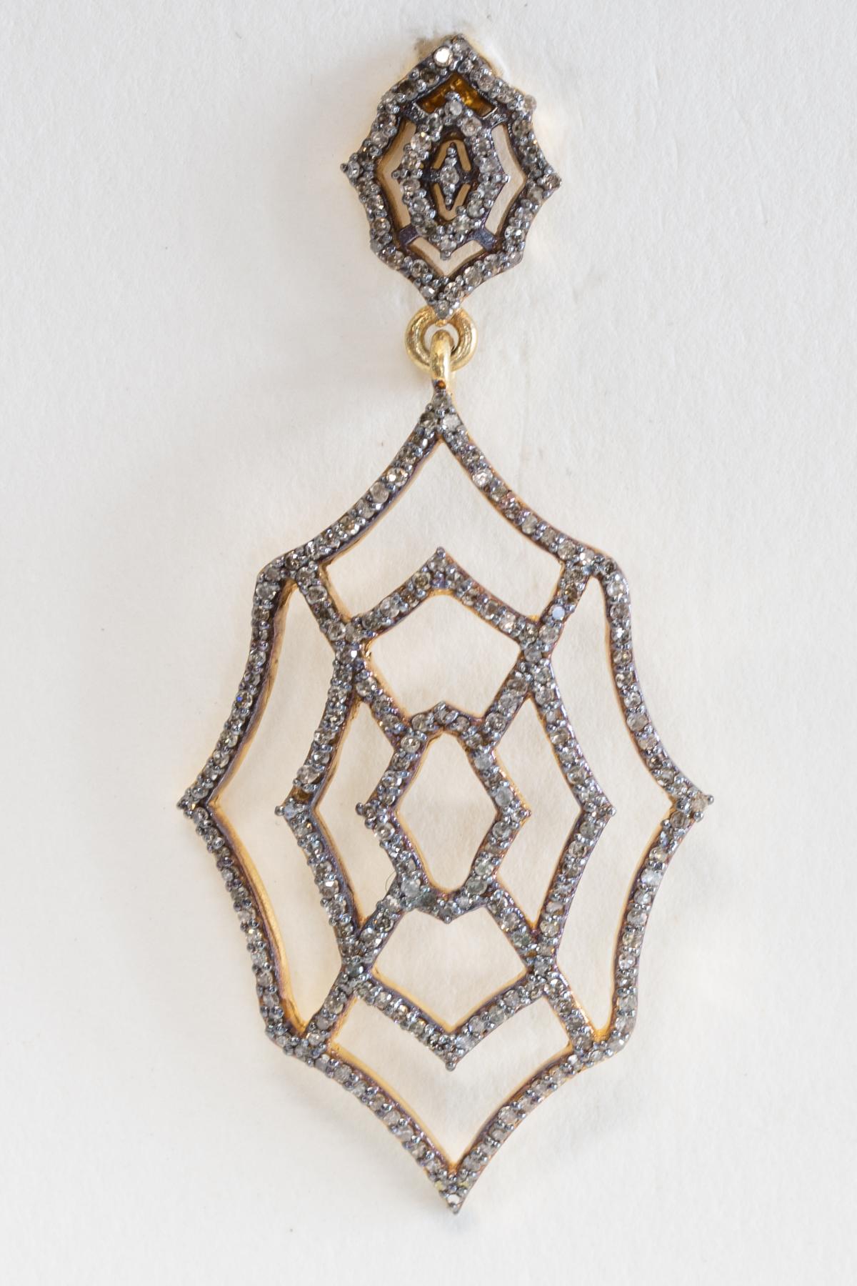 How fun are these--a pair of spider web drop earrings with pave`-set diamonds along with a web-designed post.  Gold over sterling, the post is 18K for pierced ears.  Carat weight of diamonds is 1.43