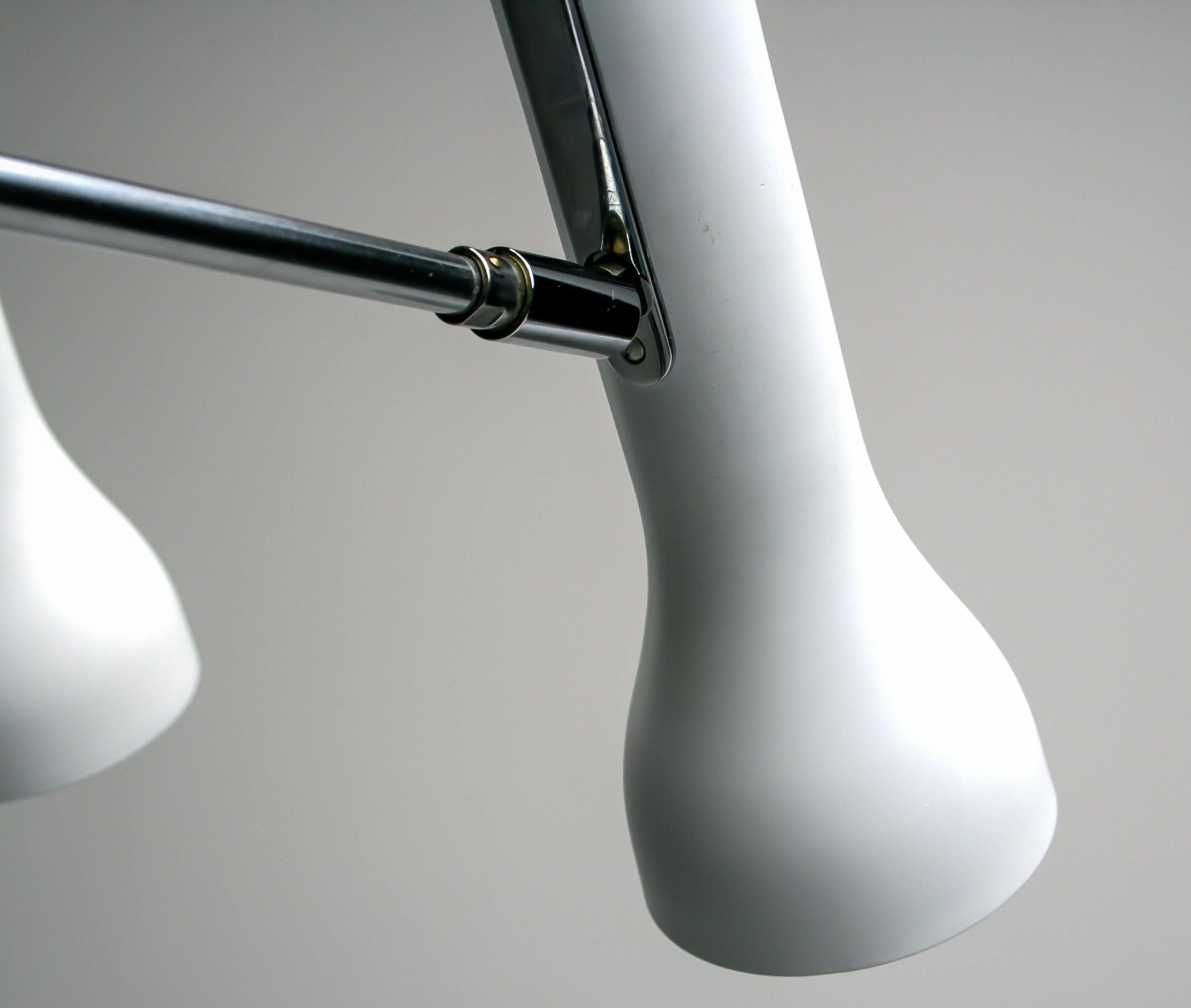 A striking and rare pair of clamp-mounted spotlights by renowned Swiss designer Dieter Waeckerlin, circa 1960s. These sculptural lamps epitomize Waeckerlin’s minimalist ethos, merging functional precision with refined Bauhaus influence.

Each