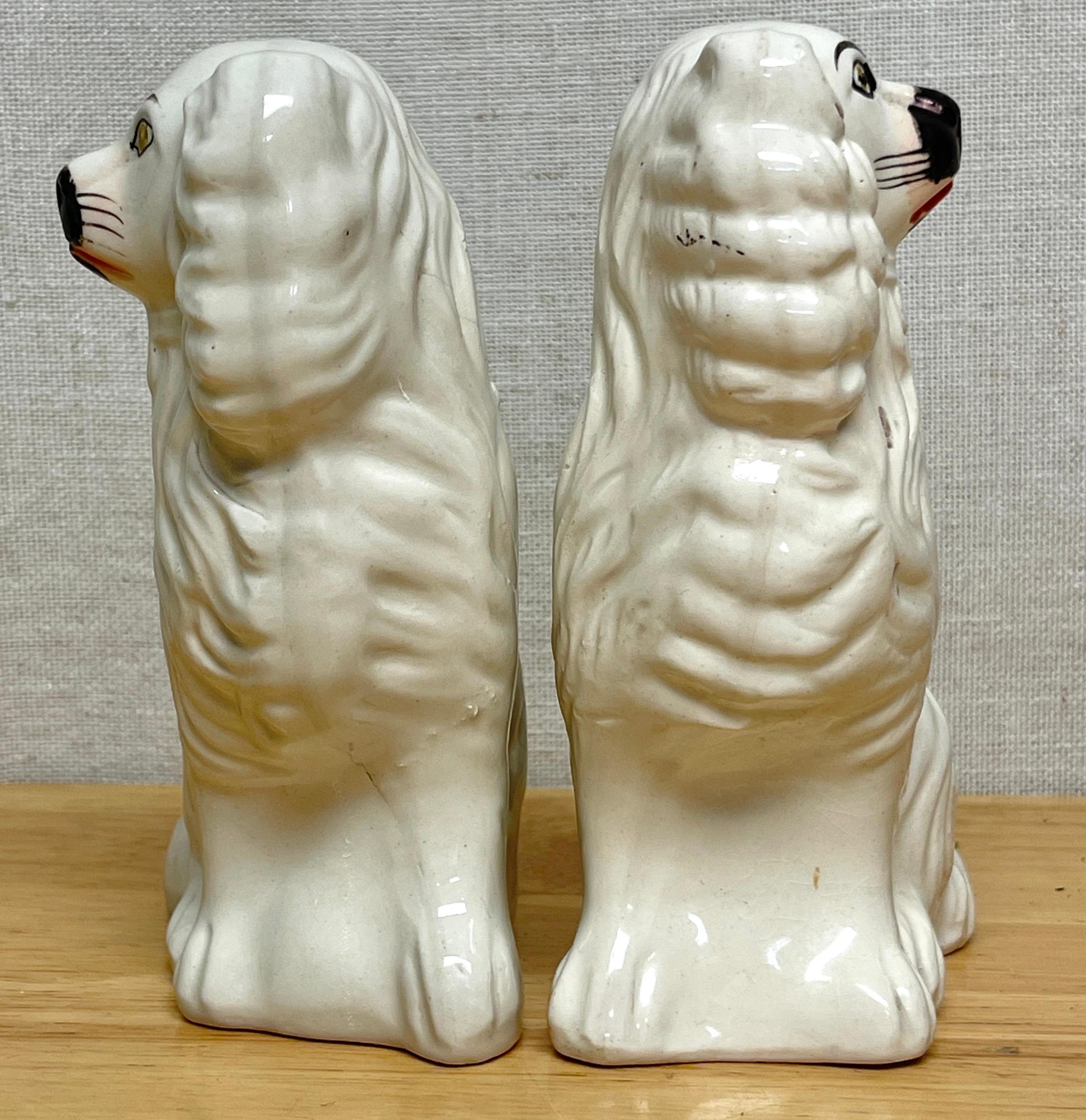 High Victorian Pair of Diminutive Antique Staffordshire Black & White Seated Spaniels, C. 1860s For Sale