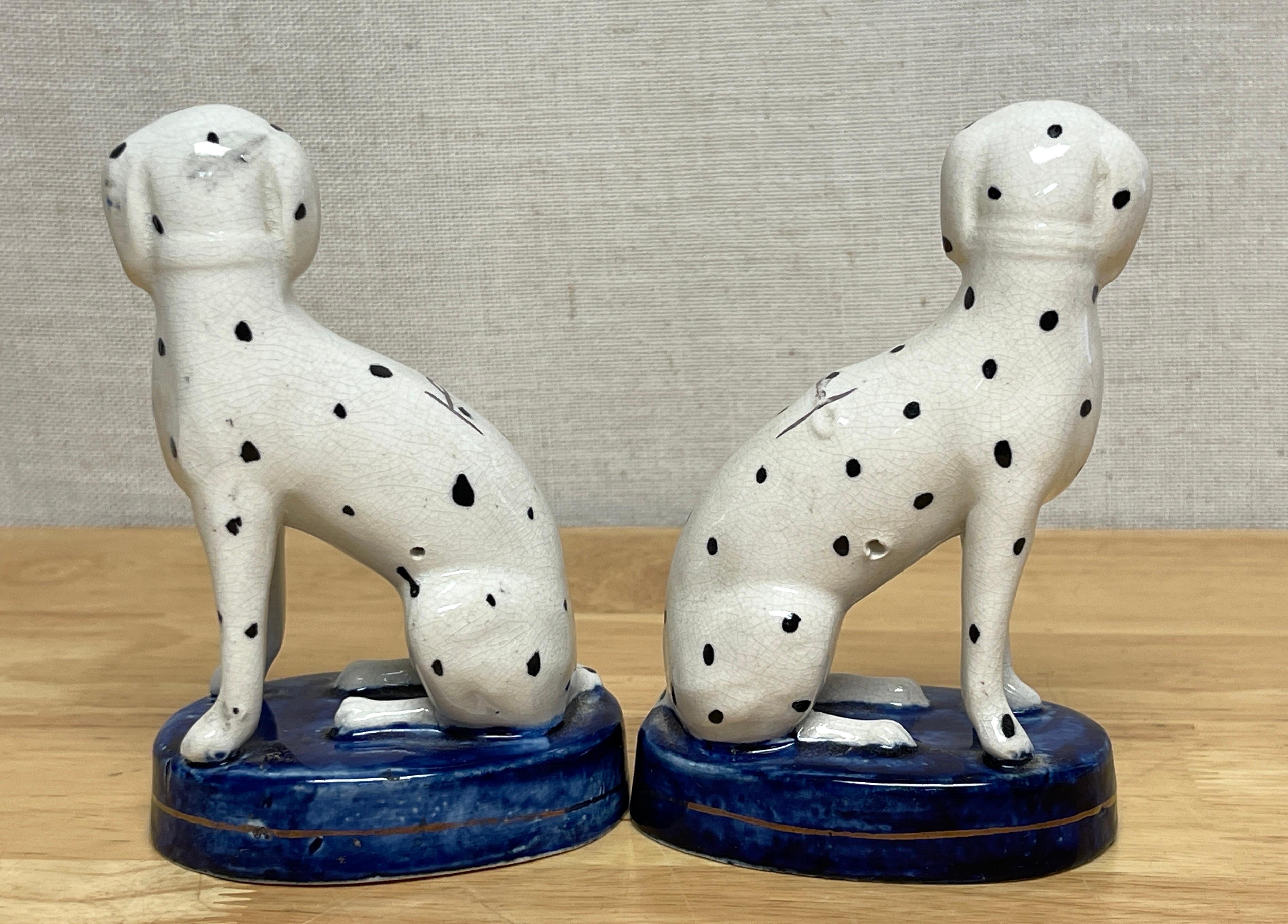 High Victorian Pair of Diminutive Antique Staffordshire Seated Dalmatians with Chains