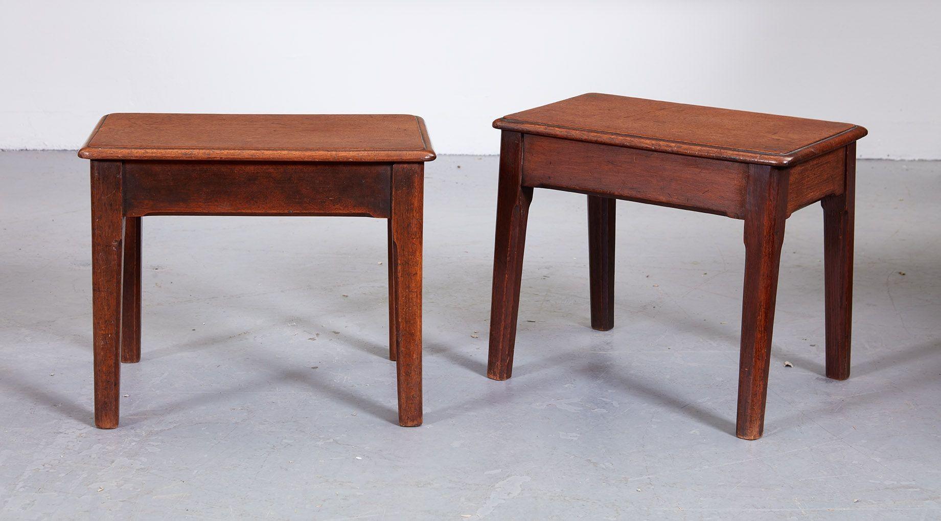 Fine pair of Georgian mahogany foot stools of diminutive scale, the thumb molded single board tops over splayed bases, the aprons with pencil chamfered edge, the legs of tapered form, the whole with good untouched surfaces and patination.
