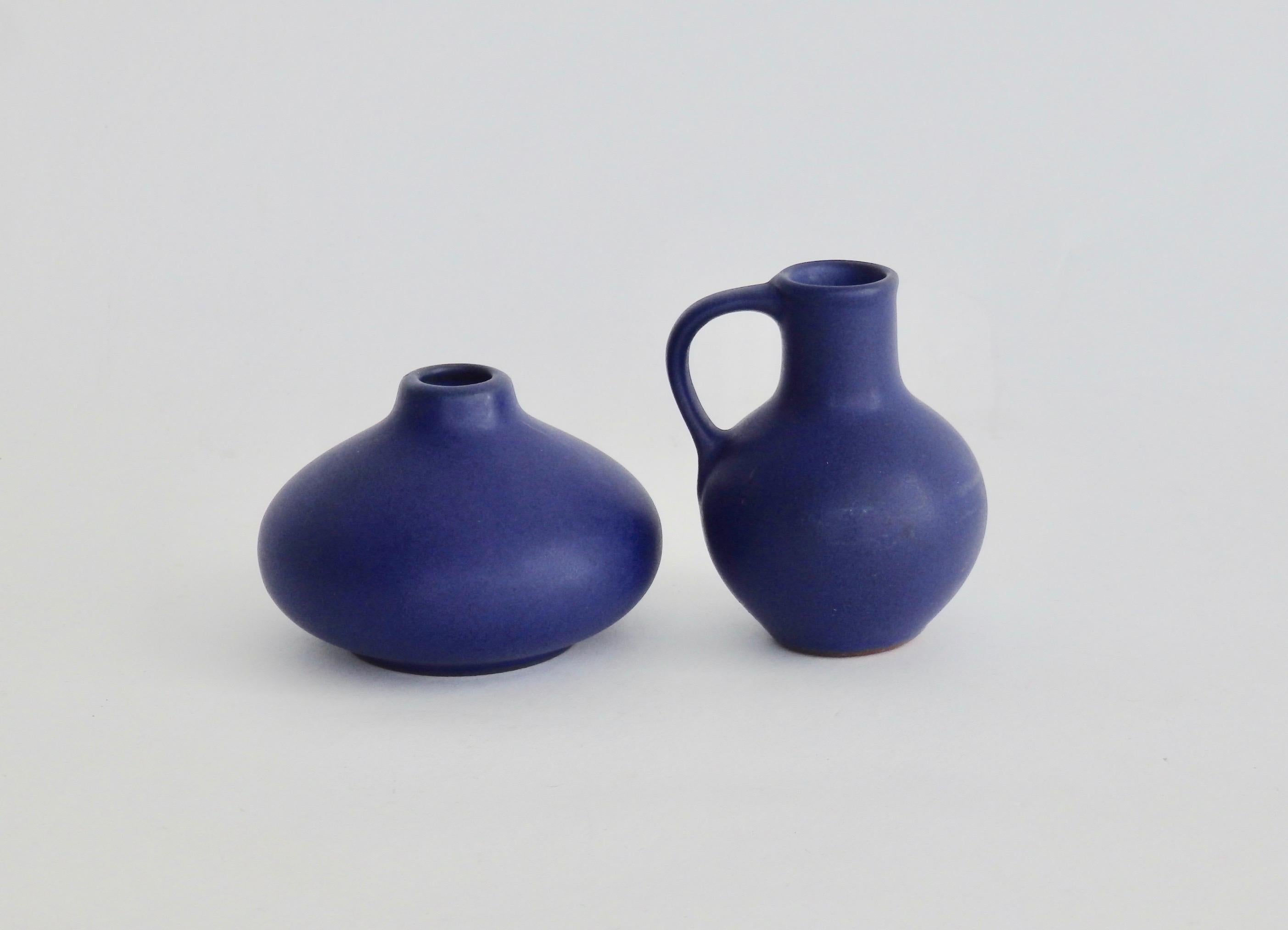 Pair of diminutive matte cobalt blue West German Pottery vessels (Numbers 819 & 806) by Marschner Kunsttopferei.
no.819 measures 3 7/8