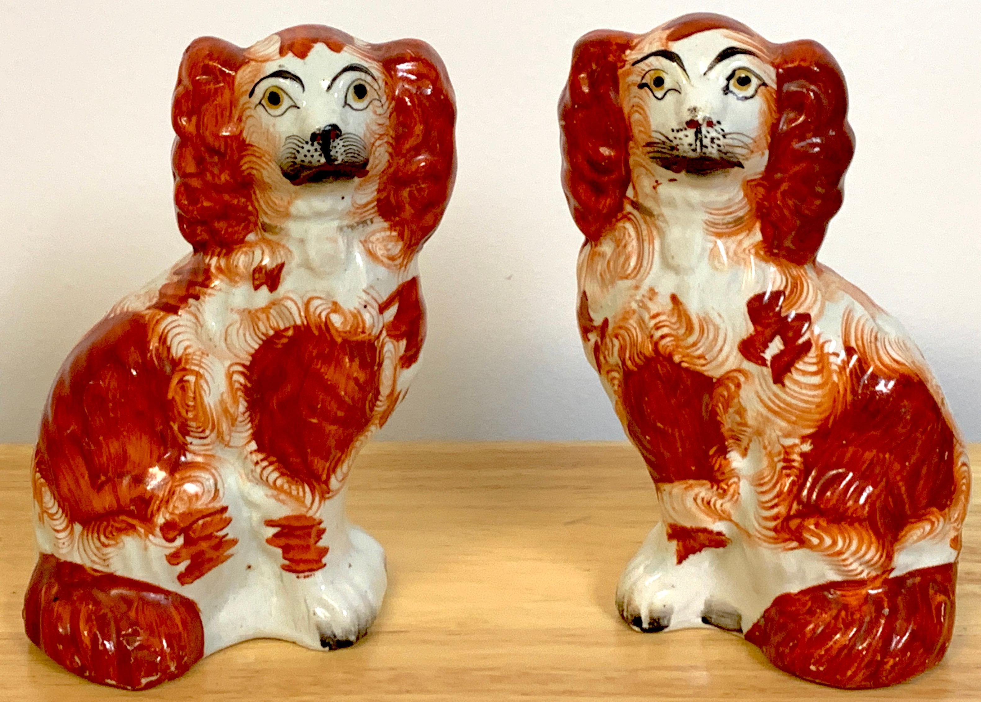 Pair of diminutive red Staffordshire Spaniels, circa 1860, Each one exceptionally painted with expressive faces.