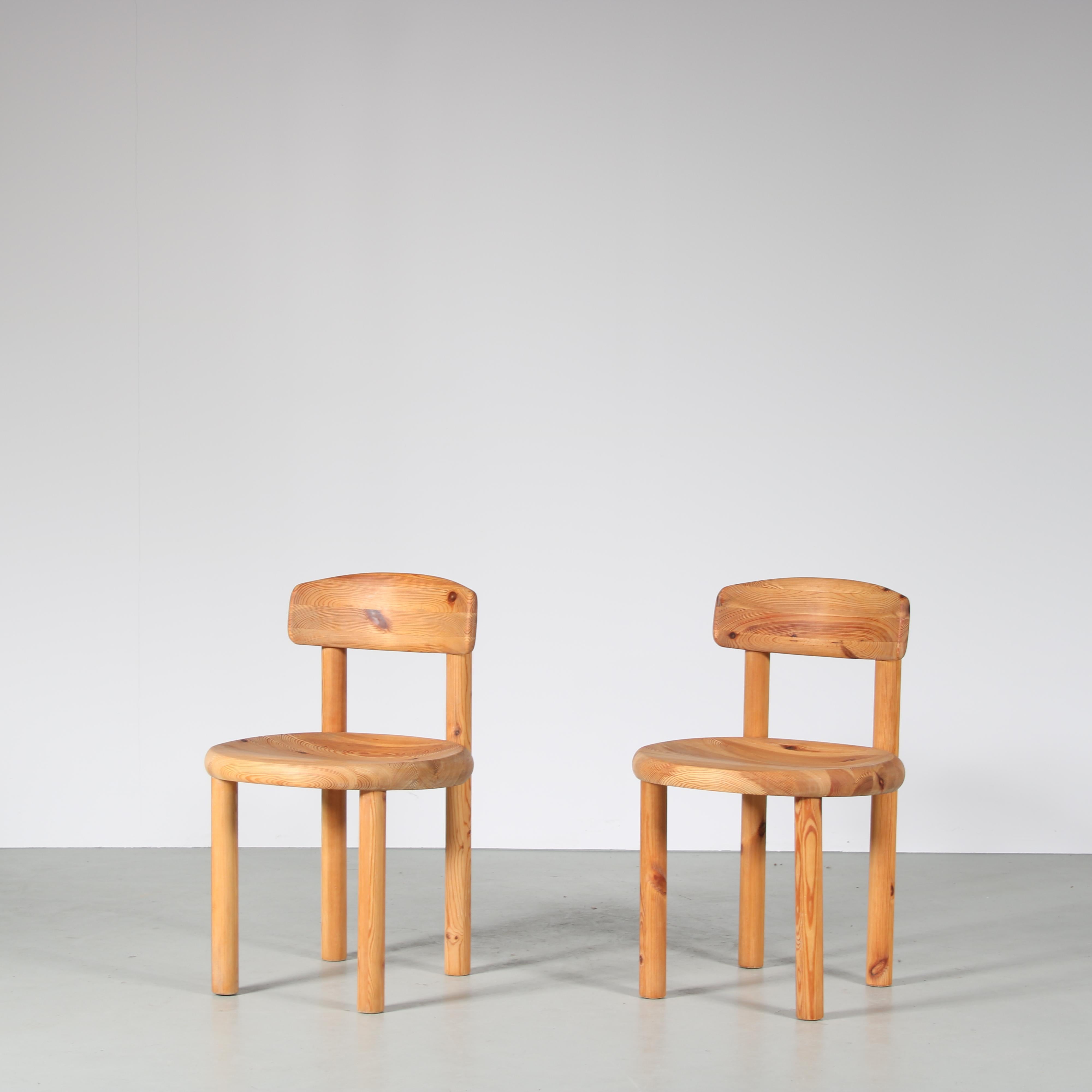 An very nice pair of dining chairs designed by Rainer Daumiller, manufactured by Hirtshals Sawmill in Denmark, circa 1970.

These eye-catching dining chairs are made of the highest quality solid pinewood in the natural rich brown / blonde color. The