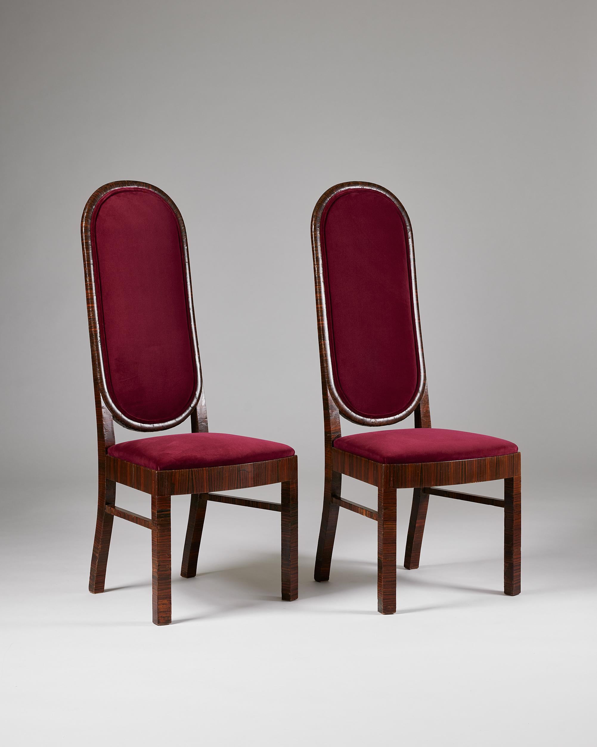 Pair of dining chairs designed by Axel Einar Hjorth for Nordiska Kompaniet,
Sweden, 1934.

Veneered Macassar ebony and velvet.

Stamped.

Provenance: The chairs are said to have stood in the restaurant of the Sports Palace by Sankt Eriksplan Bridge