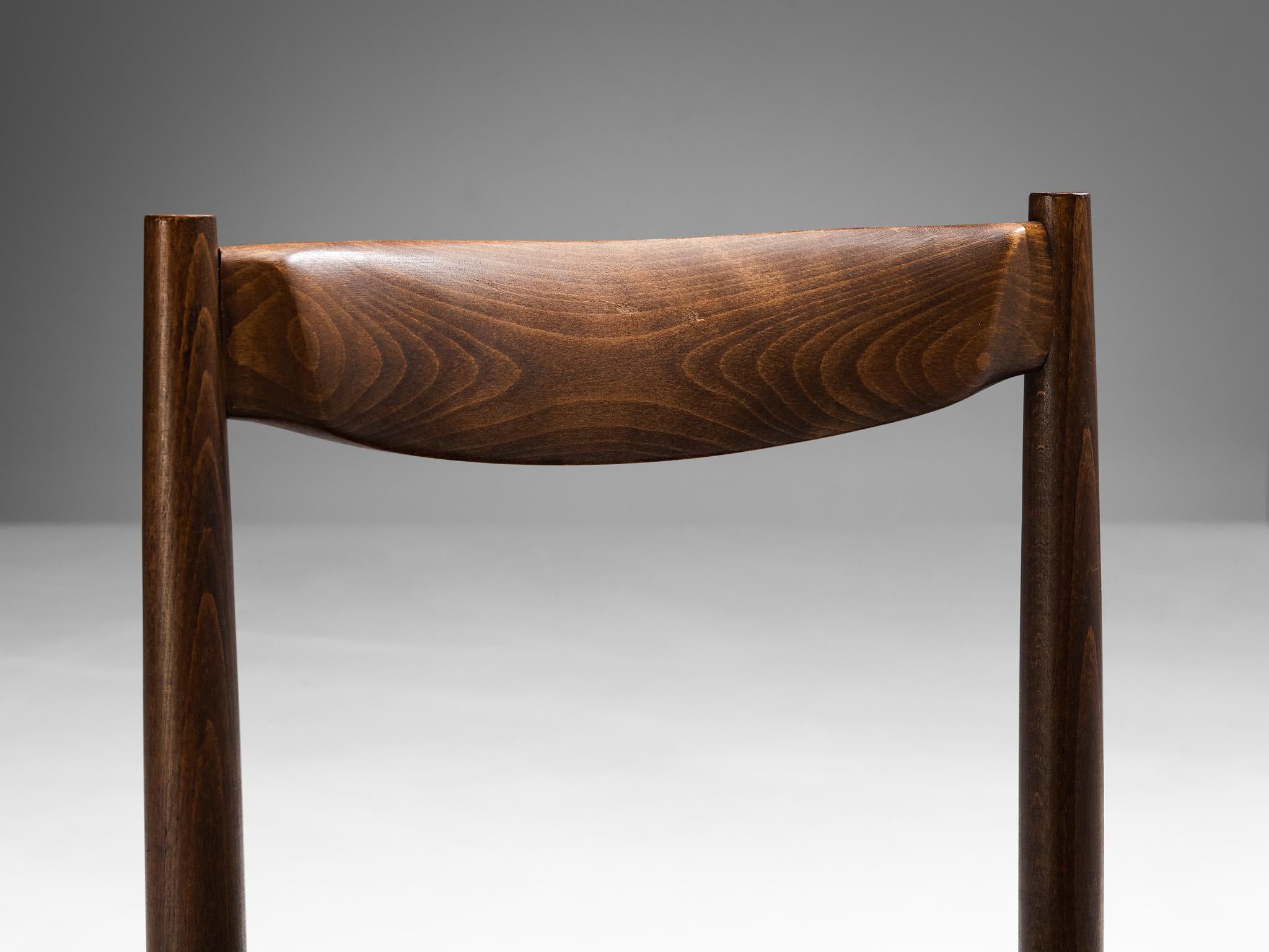 Pair of dining chairs, leatherette, stained beech, aluminum, Czech Republic, 1960s.

Well-proportioned dining chairs with constructive detailing discernible in the aluminum joints that connect the legs with the seat. The wooden frame is