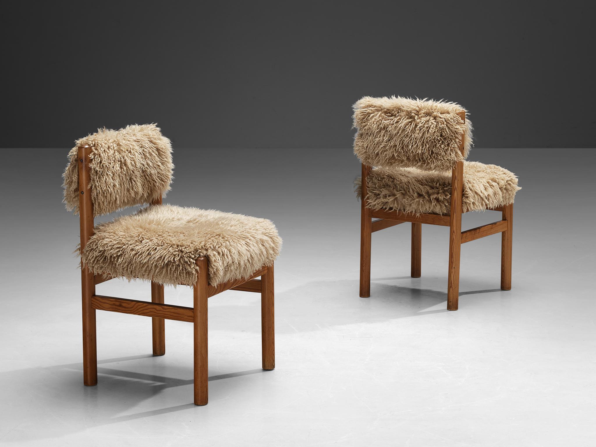 TON, pair of dining chairs, pine, reupholstered in sheepskin 