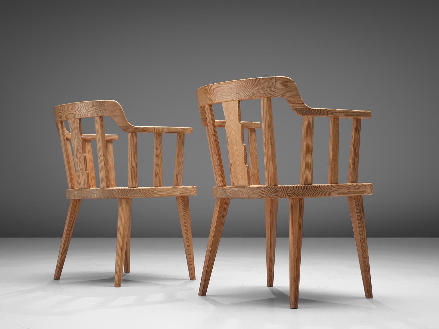 Nordiska Kompaniet, set of 2 armchairs 'Ekerö, pine, Sweden 1930s. 

Elegant set of two dining chairs. Executed in northern European pinewood. The design is simplistic; four tapered legs, solid seating and spindle or slat back. These chairs have a