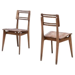 Paire de chaises de salle à manger en jonc par Pierre Cruège - style Roger Landault