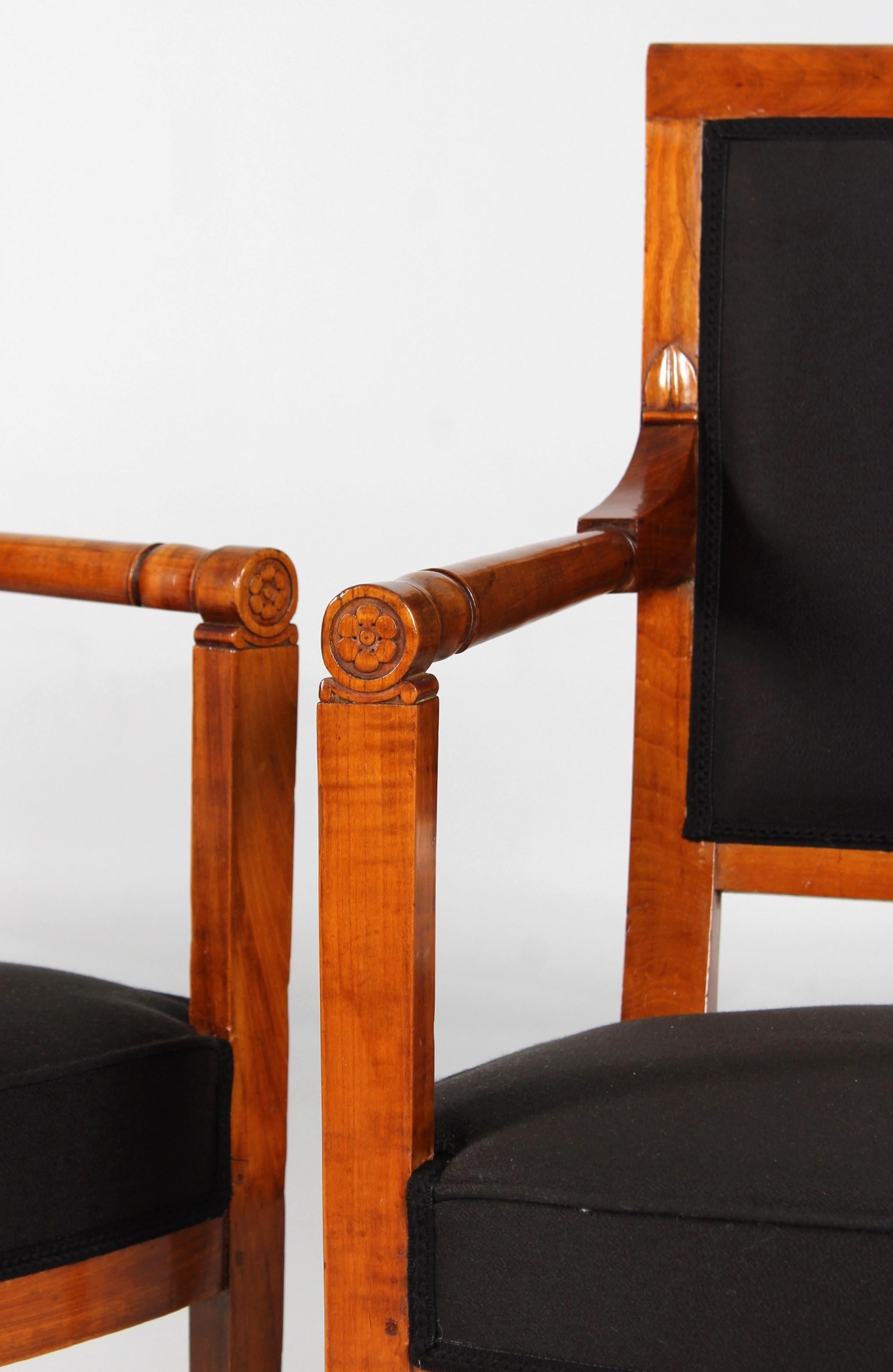 Pair of antique cherry armchairs

France
Cherry
Directoire around 1800

Dimensions: H x W x D: 87 x 58 x 49 cm, seat height: 43 cm

Description:
Pair of elegant and interestingly shaped armchairs made of solid cherry. The lines, straight in the