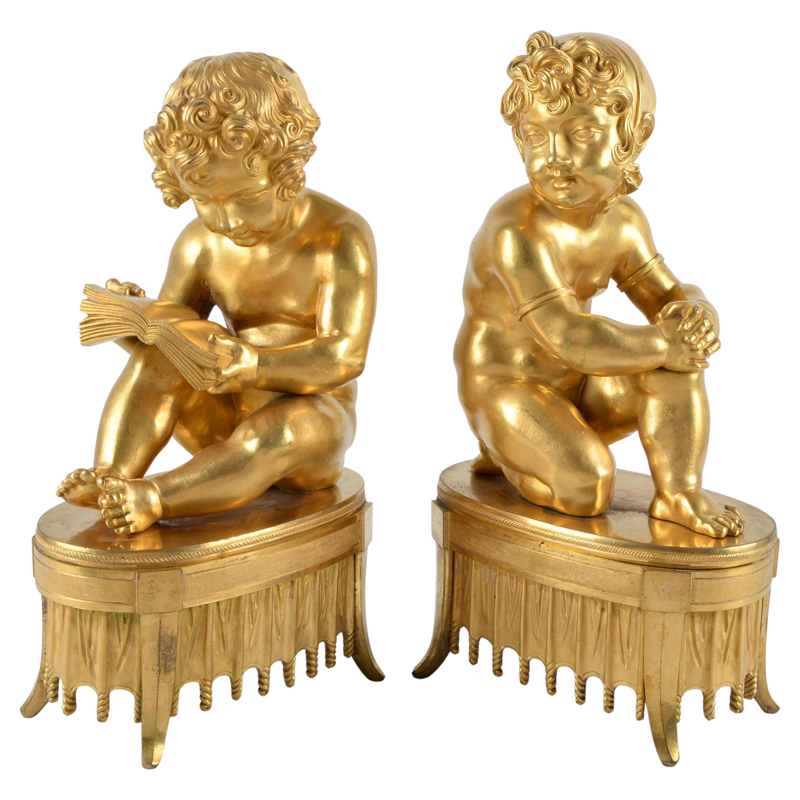 Paire de sculptures allégoriques d'enfants du Directoire en bronze doré