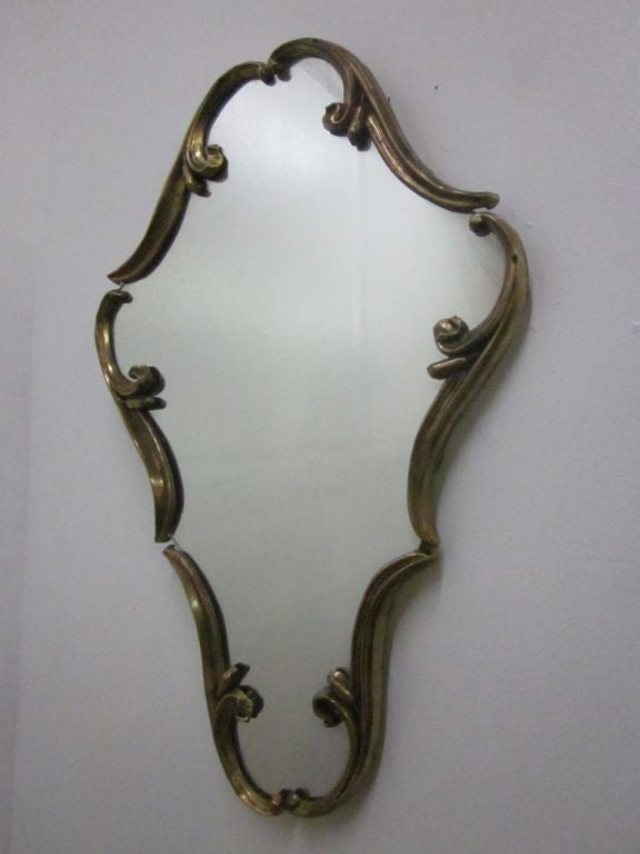 Pair of Directoire style French mirrors. Mirrors have a decorative metal frame with a gold painted finish. Back of the mirrors is wood.
Measures: 37 H x 24 W (at its widest).