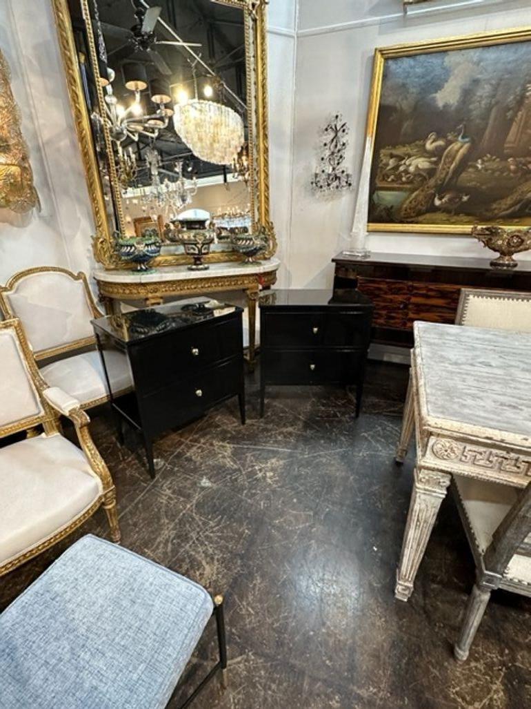 Elegant pair of Directoire' style side tables. Painted in a sleek piano black finish. Excellent quality. Gorgeous!