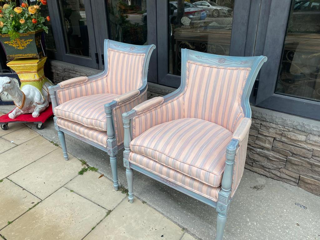 Well made Directoire style polychrome Bergers Fauteuils in pink and blue striped upholstery fabric recently re-done with down cushions and polychromed lacquered re-freshed in light blue having a 
