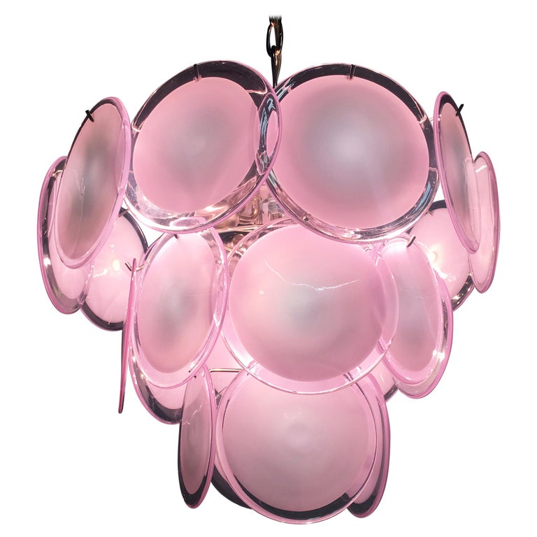 Vistosi midcentury pink discs Murano glass Italian chandeliers.

Spectacular pair chandeliers by Vistosi made in Murano formed by 23 pink discs of precious Murano glass are arranged on floor levels. Nine lights. Measures: Height without chain 50