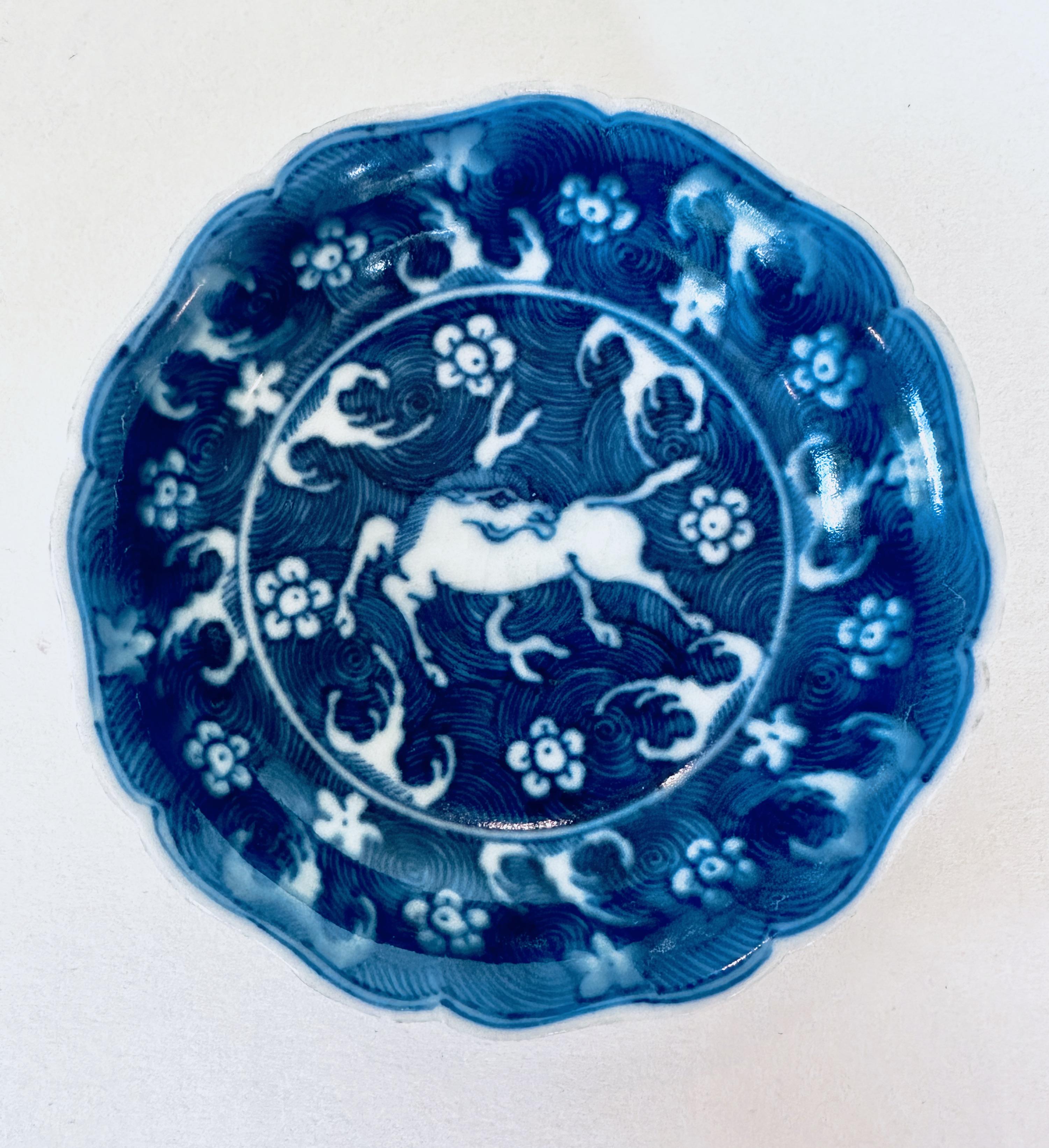 Pair of Dishes decorated with a white horse on a background of blue spirals, 17th century.

These dishes were part of a hoard recovered by Captain Michael Hatcher from the wreck of a ship that sunk in the South China sea in approximately 1643.