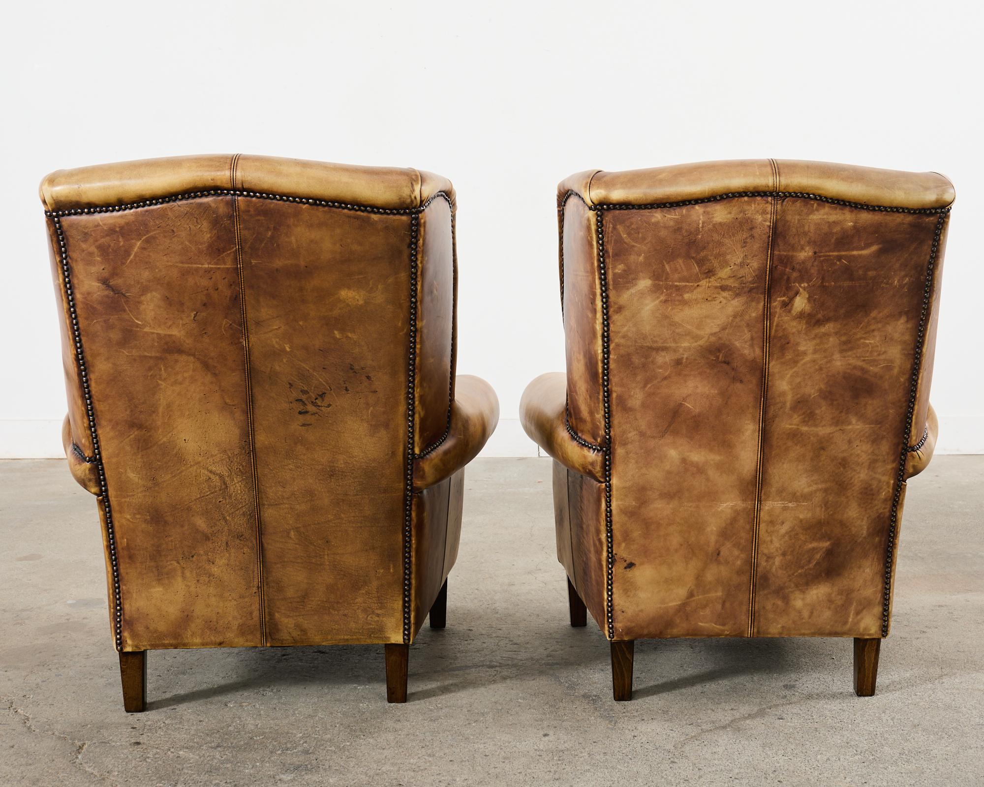 Pair of Distressed Cigar Leather Wingback Chairs with Ottomans 5
