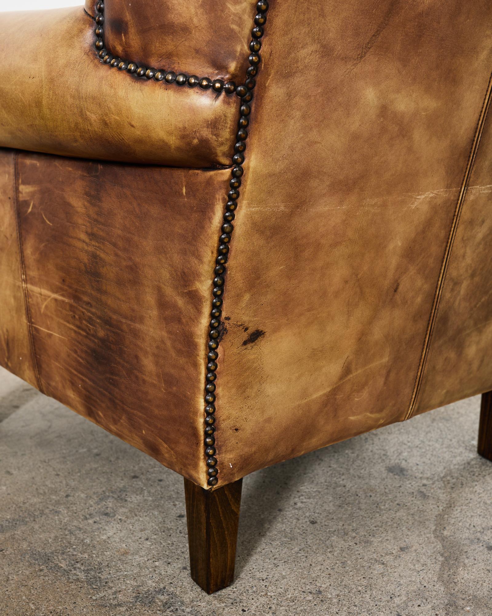 Pair of Distressed Cigar Leather Wingback Chairs with Ottomans 7