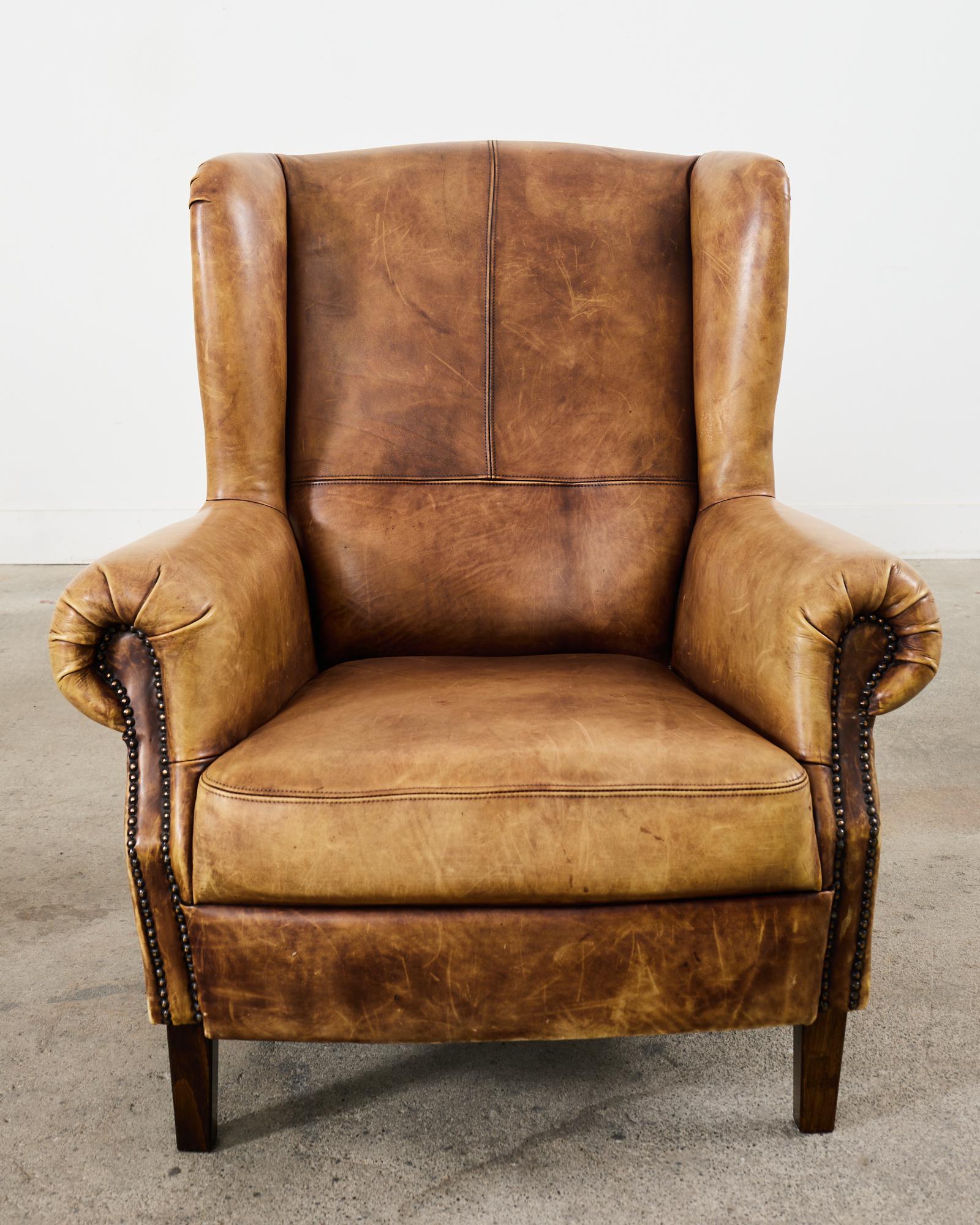 Pair of Distressed Cigar Leather Wingback Chairs with Ottomans 8