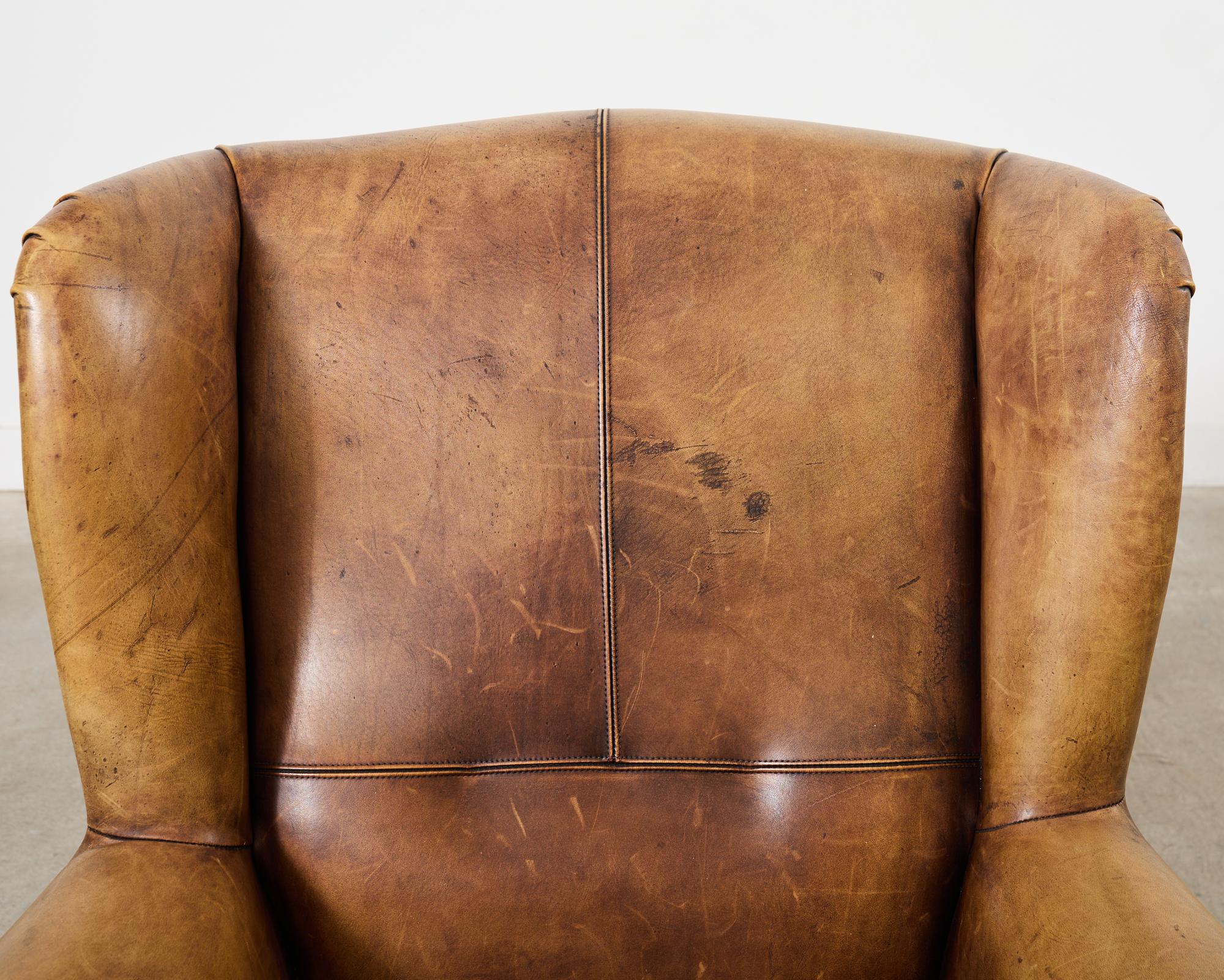 Pair of Distressed Cigar Leather Wingback Chairs with Ottomans 9