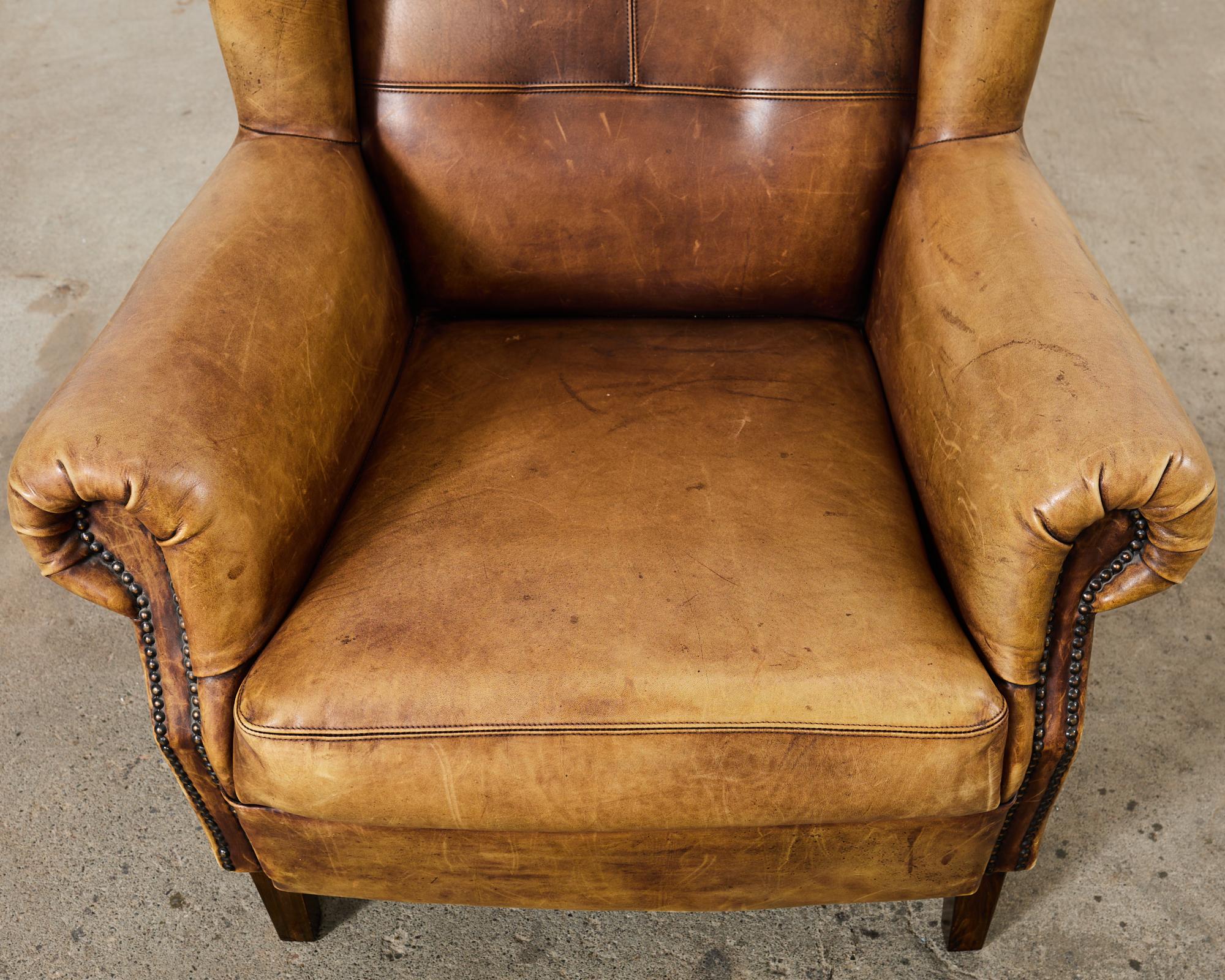 Pair of Distressed Cigar Leather Wingback Chairs with Ottomans 10