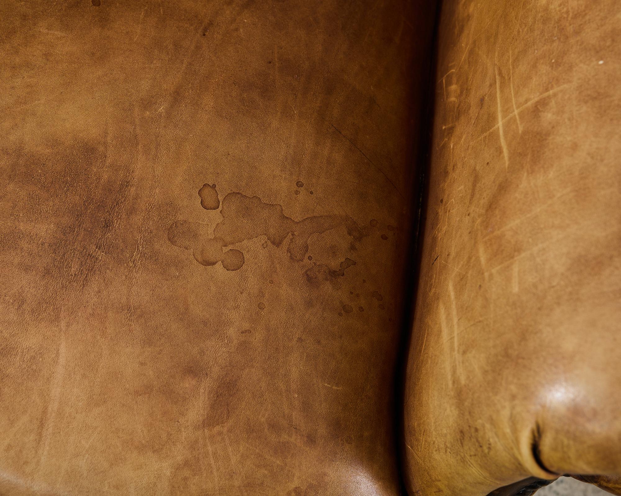 Pair of Distressed Cigar Leather Wingback Chairs with Ottomans 11