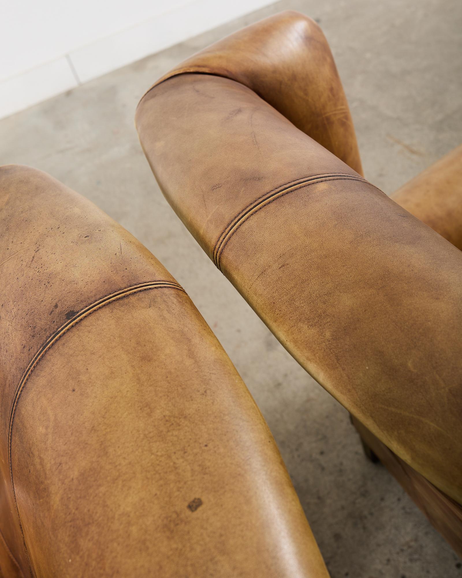 Pair of Distressed Cigar Leather Wingback Chairs with Ottomans 1