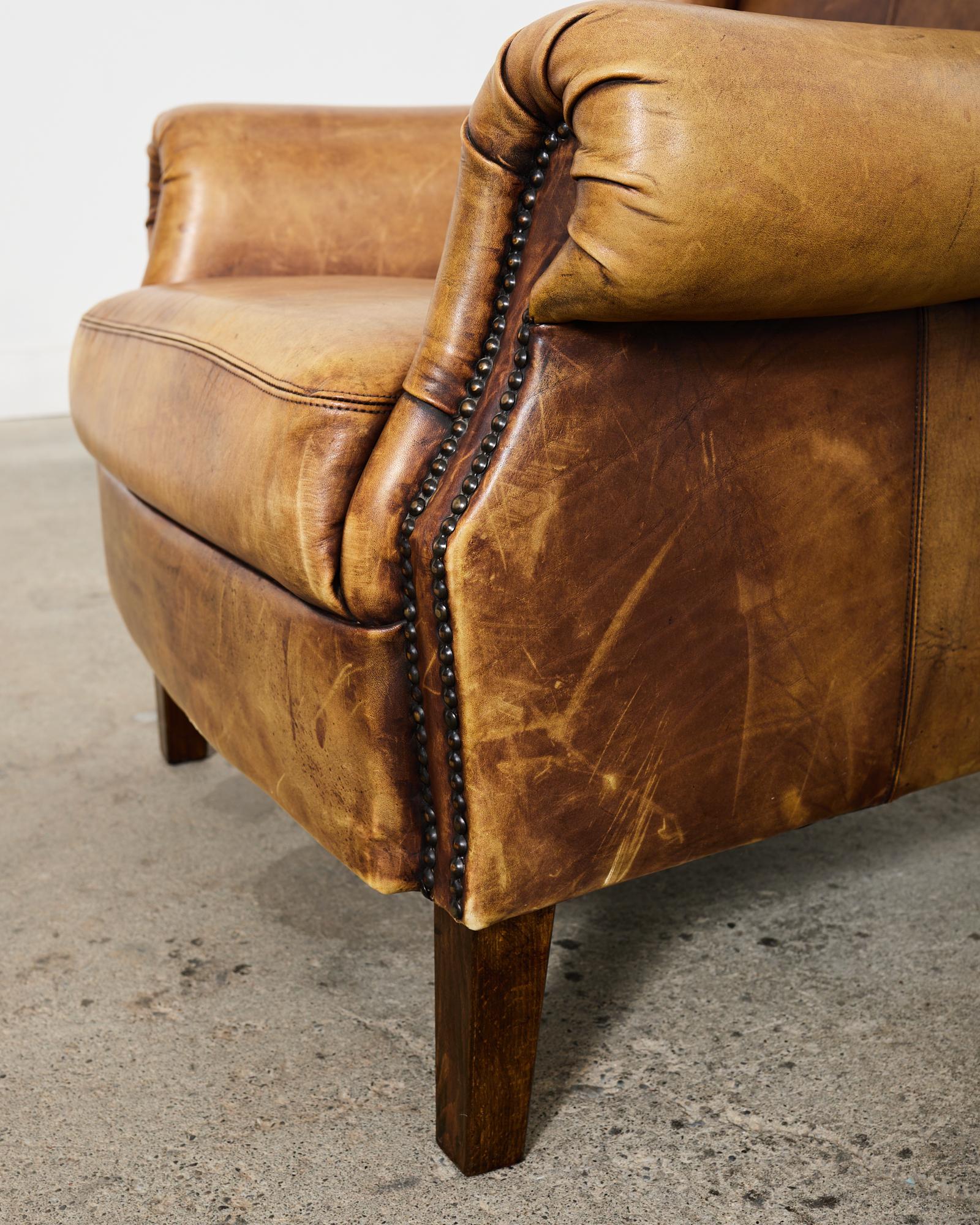 Pair of Distressed Cigar Leather Wingback Chairs with Ottomans 2