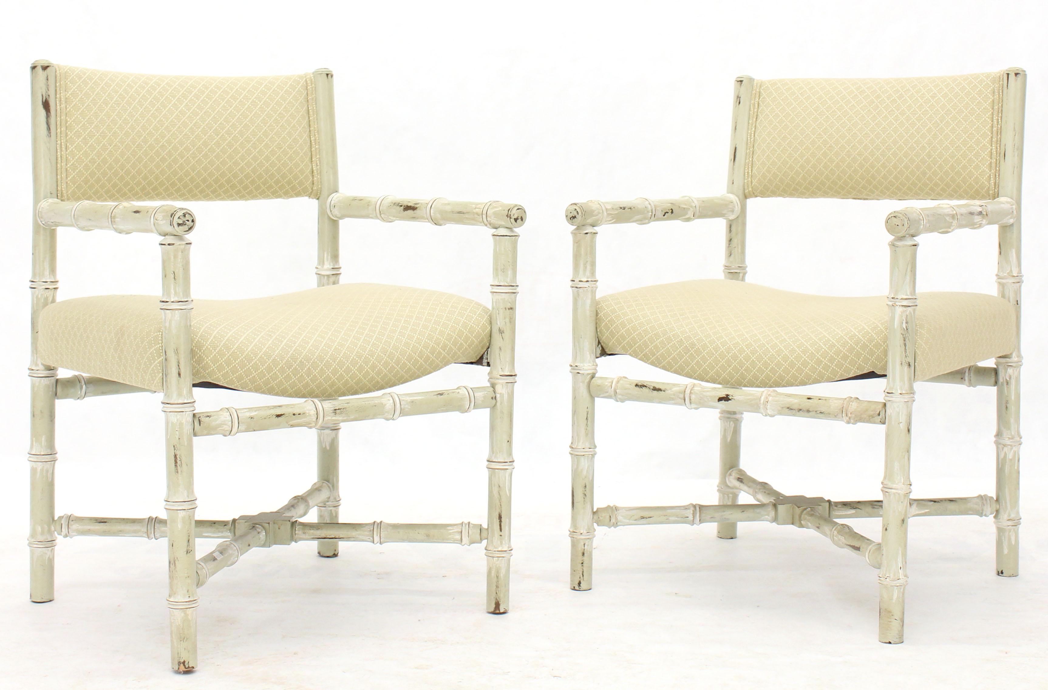 Pair of solid Mid-Century Modern lounge capitan chairs in distressed white finish and X bases. Baker or Drexel style and quality pieces.
 