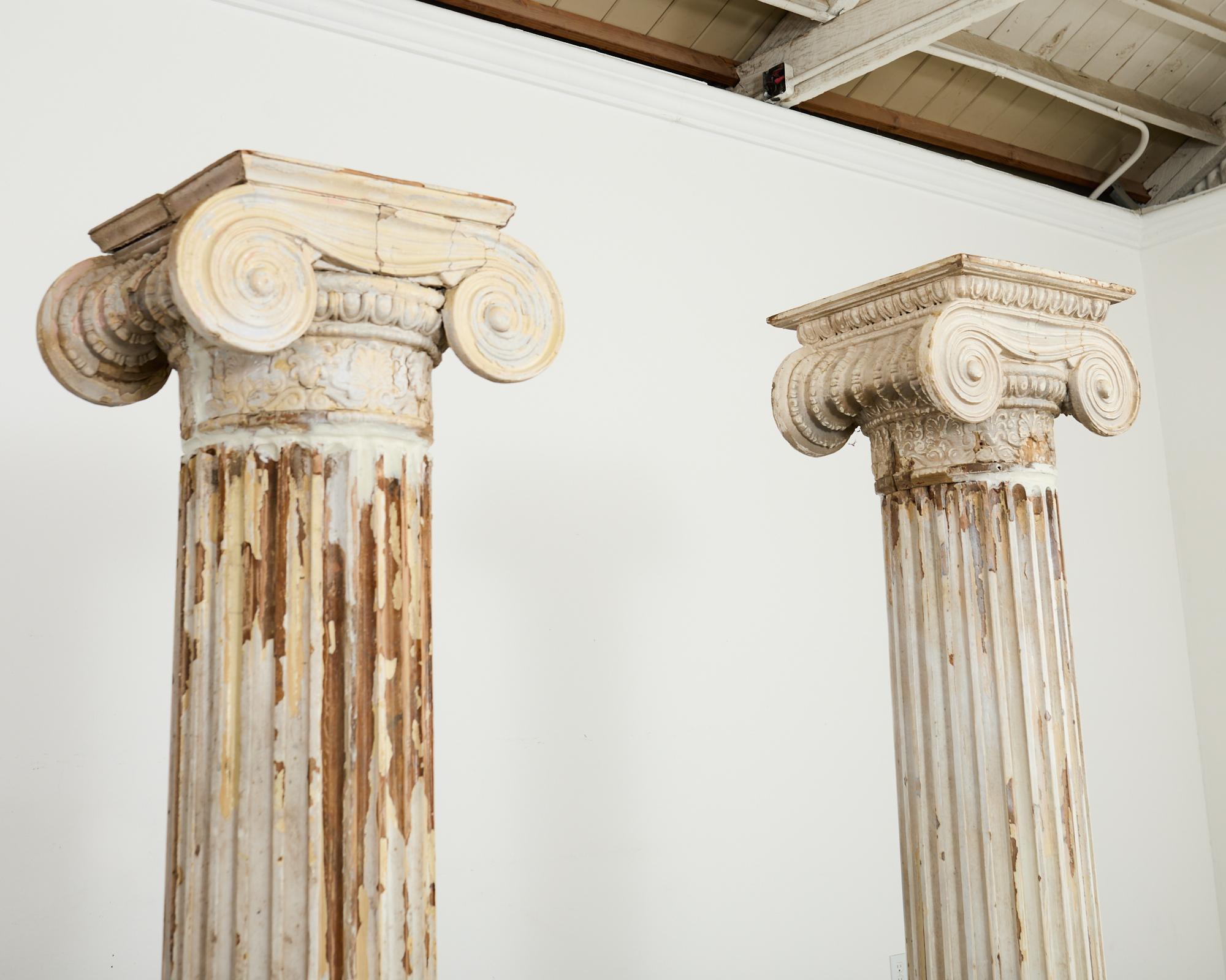 Pair of Distressed Greco-Roman Neoclassical Style Ionic Columns In Distressed Condition In Rio Vista, CA