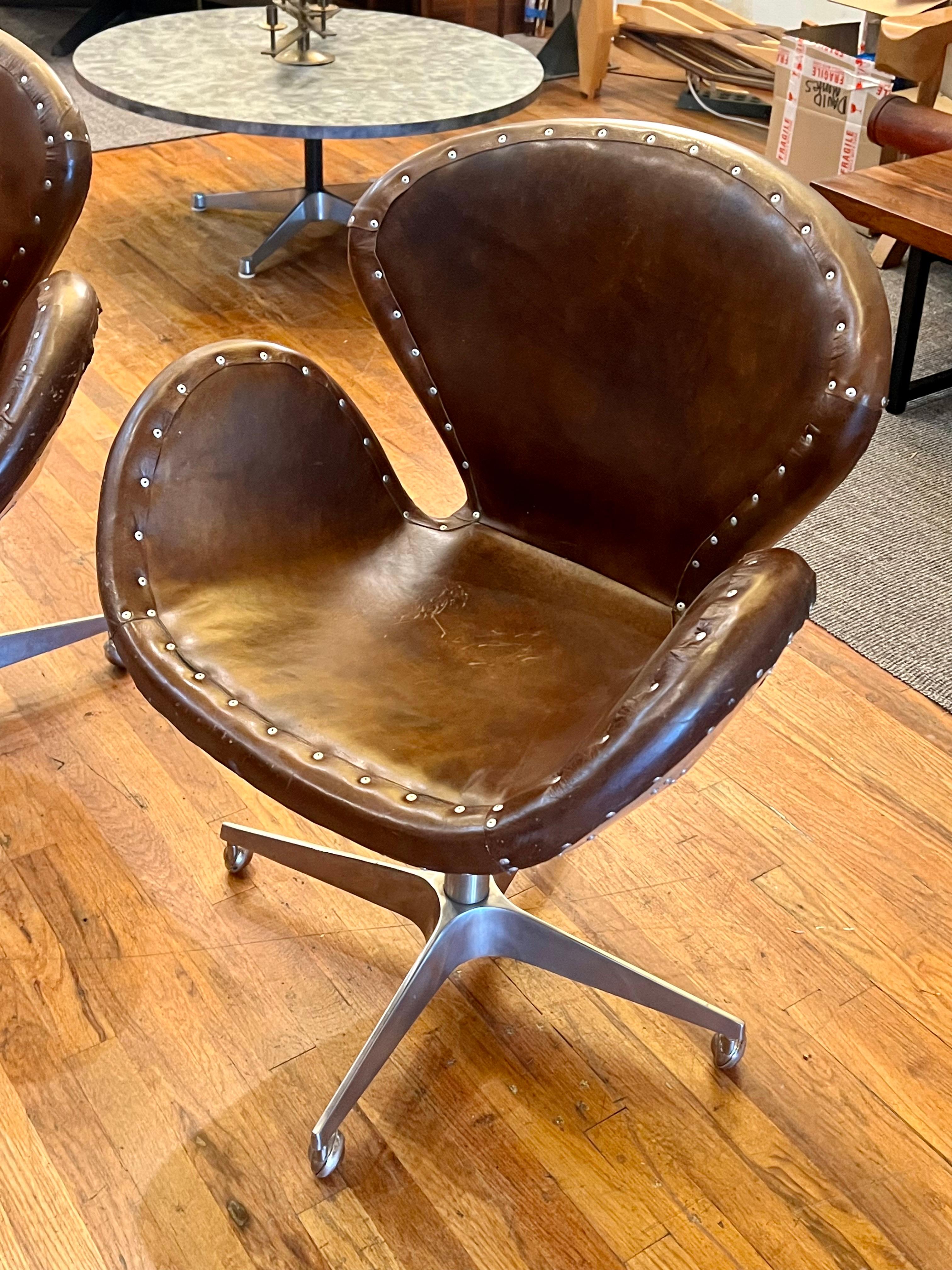 20th Century Pair of Distressed Leather Swivel Base Aviator Armchairs by Restoration hardware For Sale