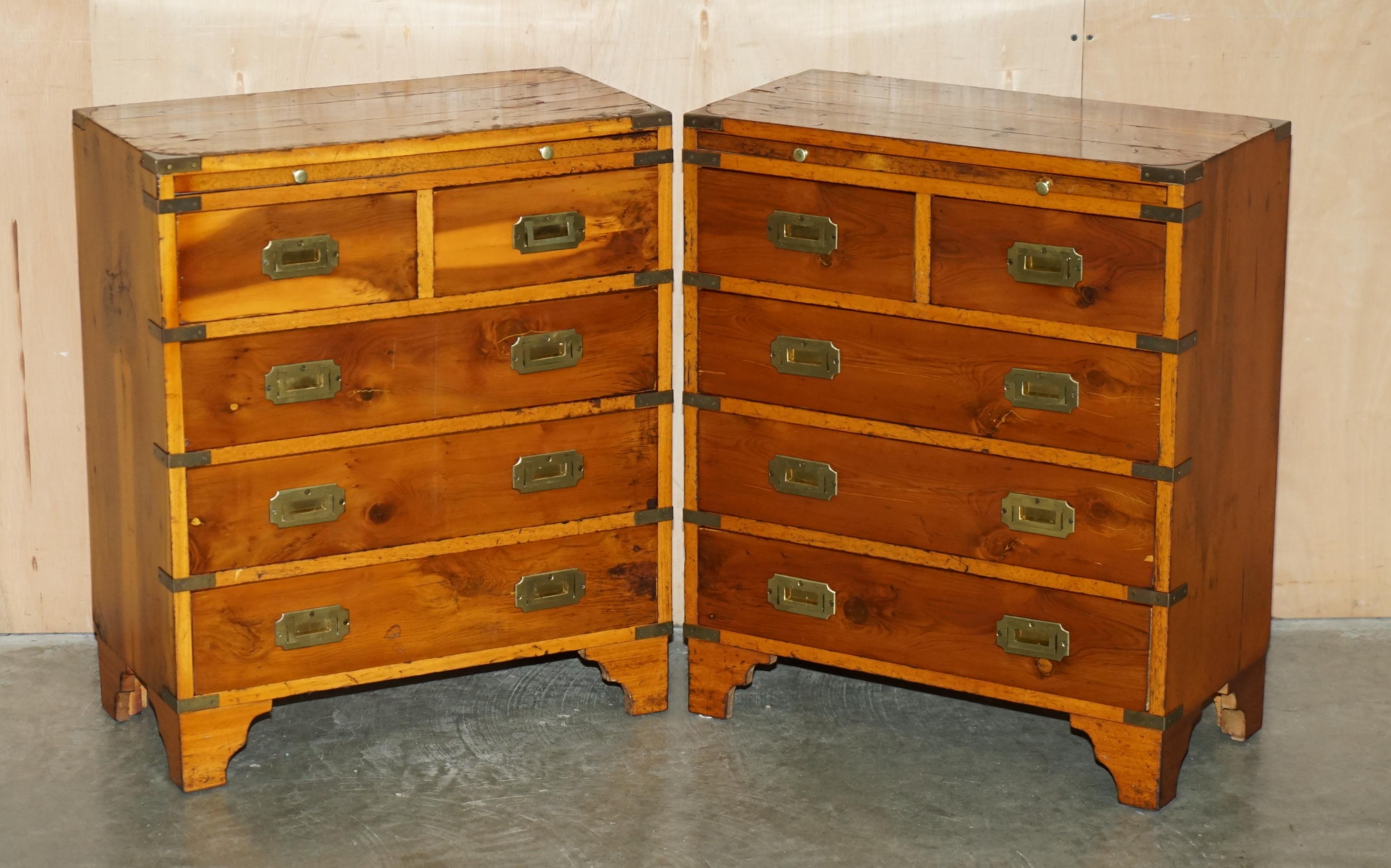 Royal House Antiques

Royal House Antiques is delighted to offer for sale this lovely pair of vintage Burr Yew wood & brass mounted Military Campaign style side tables with drawers that have well patinated tops and butlers slip serving trays