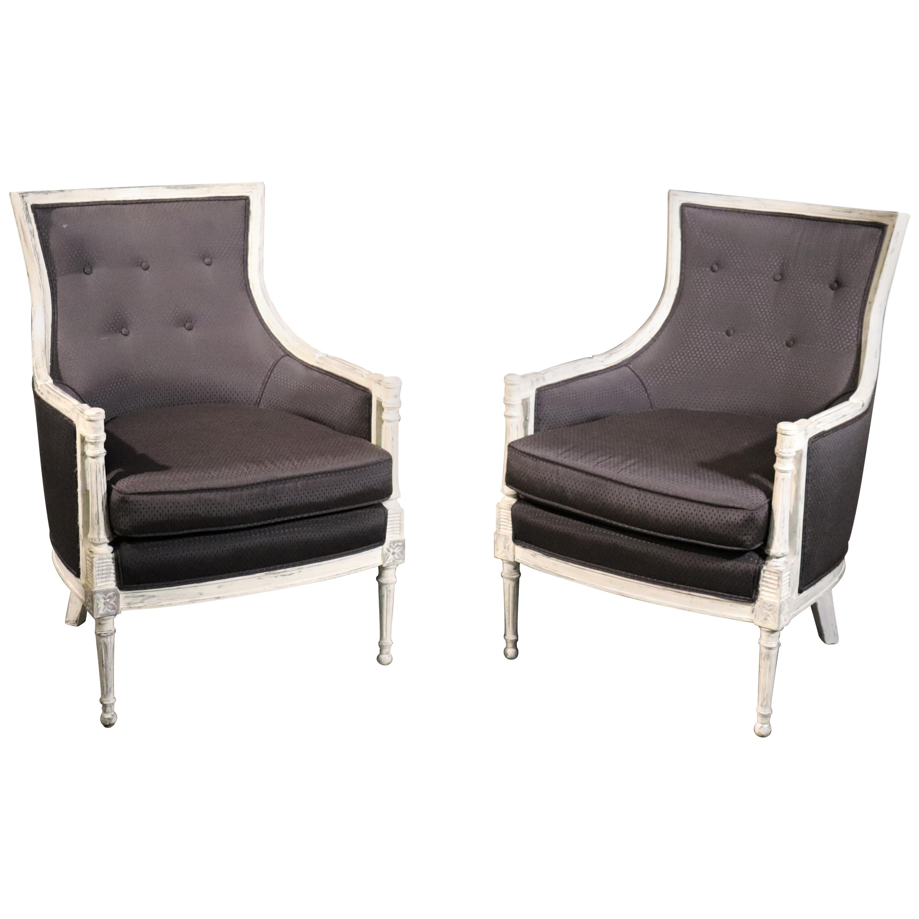 Pair of Distressed Painted Black Upholstered French Louis XVI Bergère Chairs