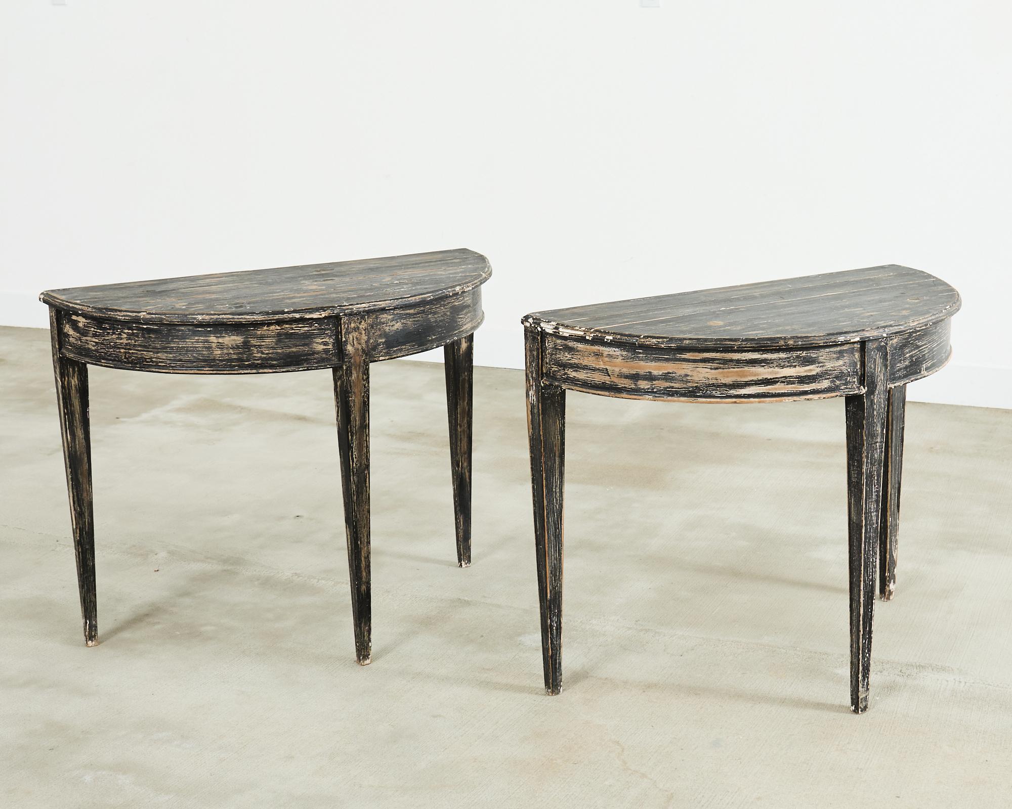 20th Century Pair of Distressed Swedish Pine Painted Demilune Consoles