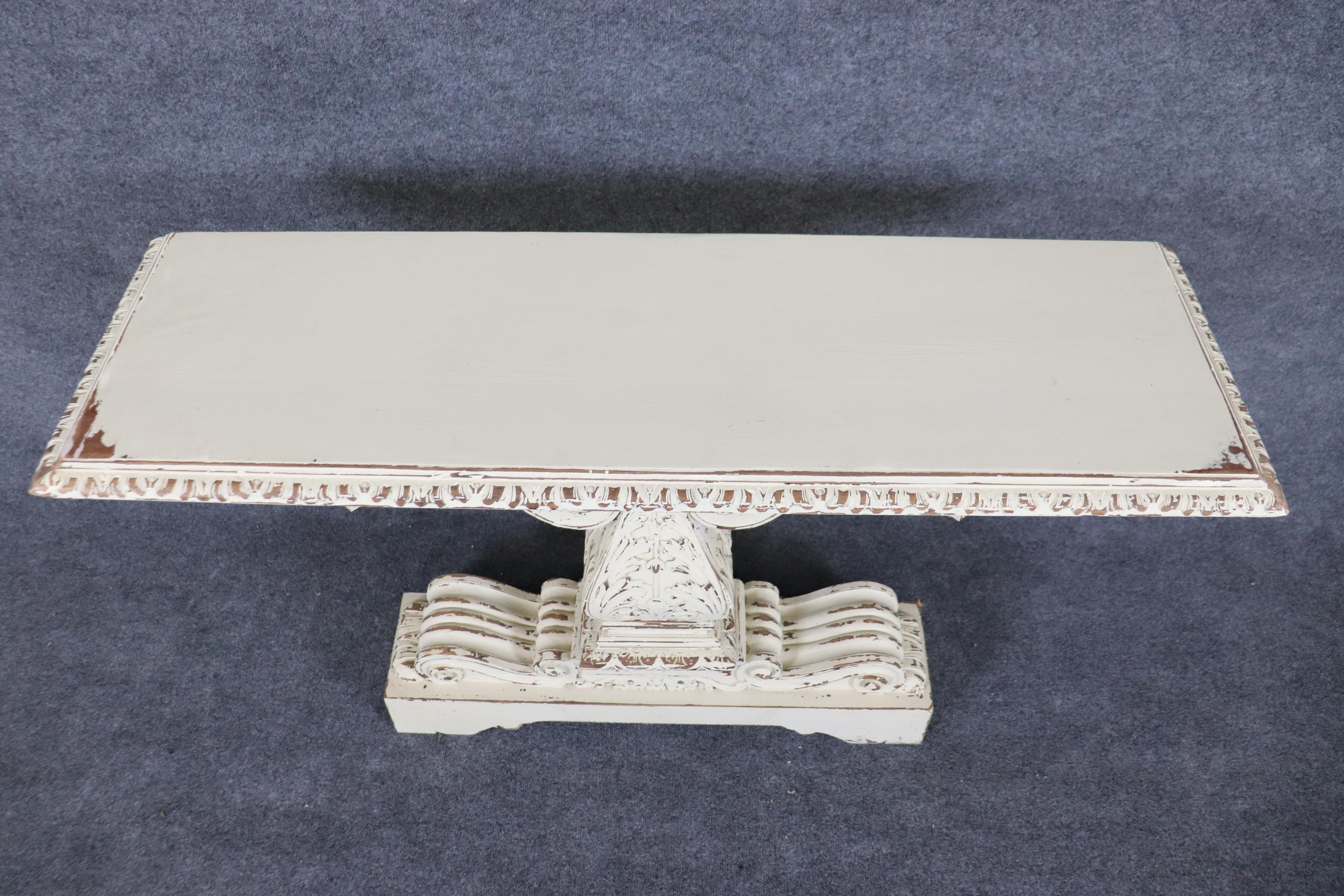 This is a fantastic pair of Jacobean style white distressed painted large console tables. They will add a major and rather soft focal point to a room that needs consoles that aren't read as overtly bulky but still retain some relative visual weight