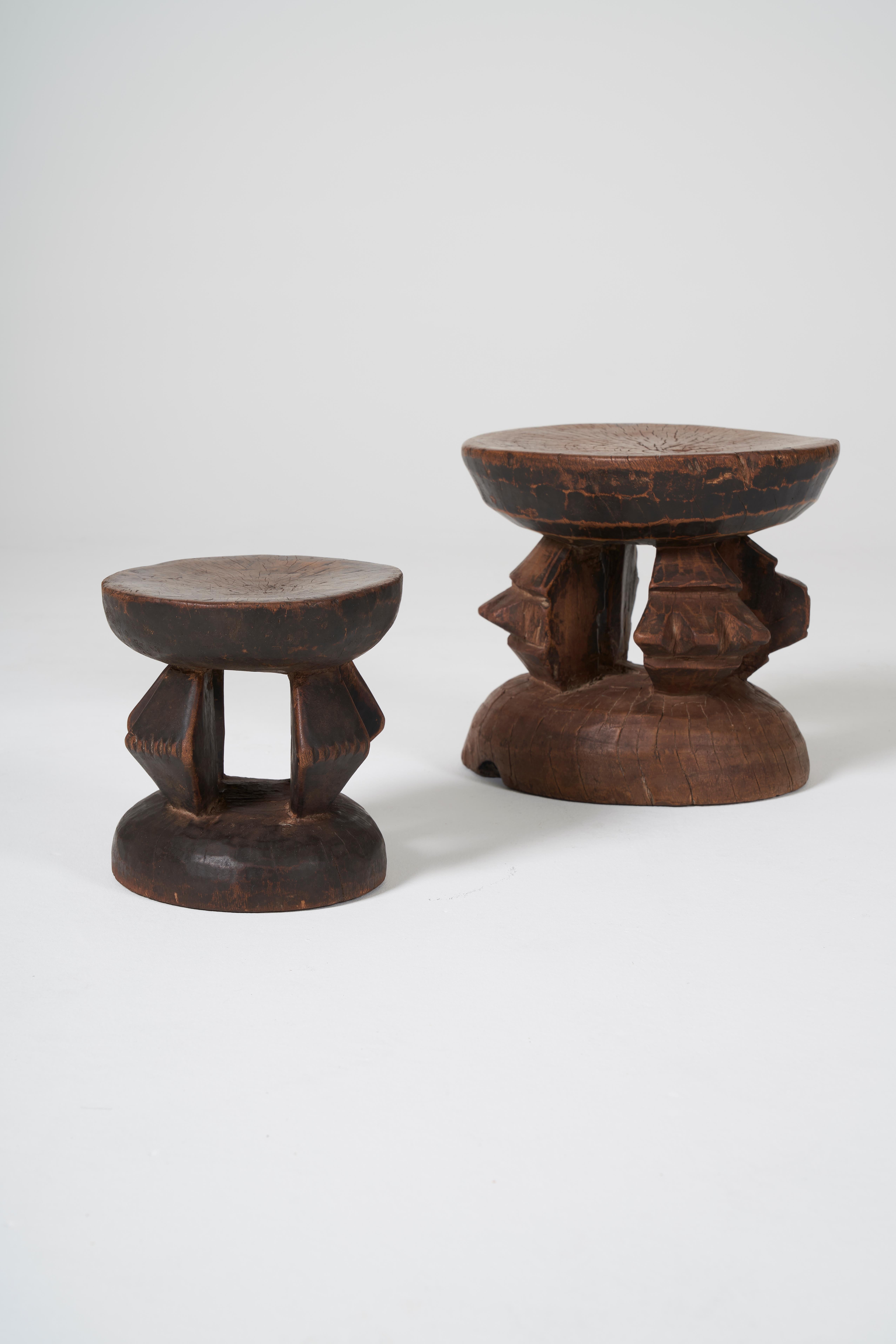 Pair of Dogon monoxyl stools from Mali, early 20th century. These stools, like family heirlooms in Western cultures, become more valuable in Africa as they age. With a beautiful patina, these stools have been used and bear the marks of their age.