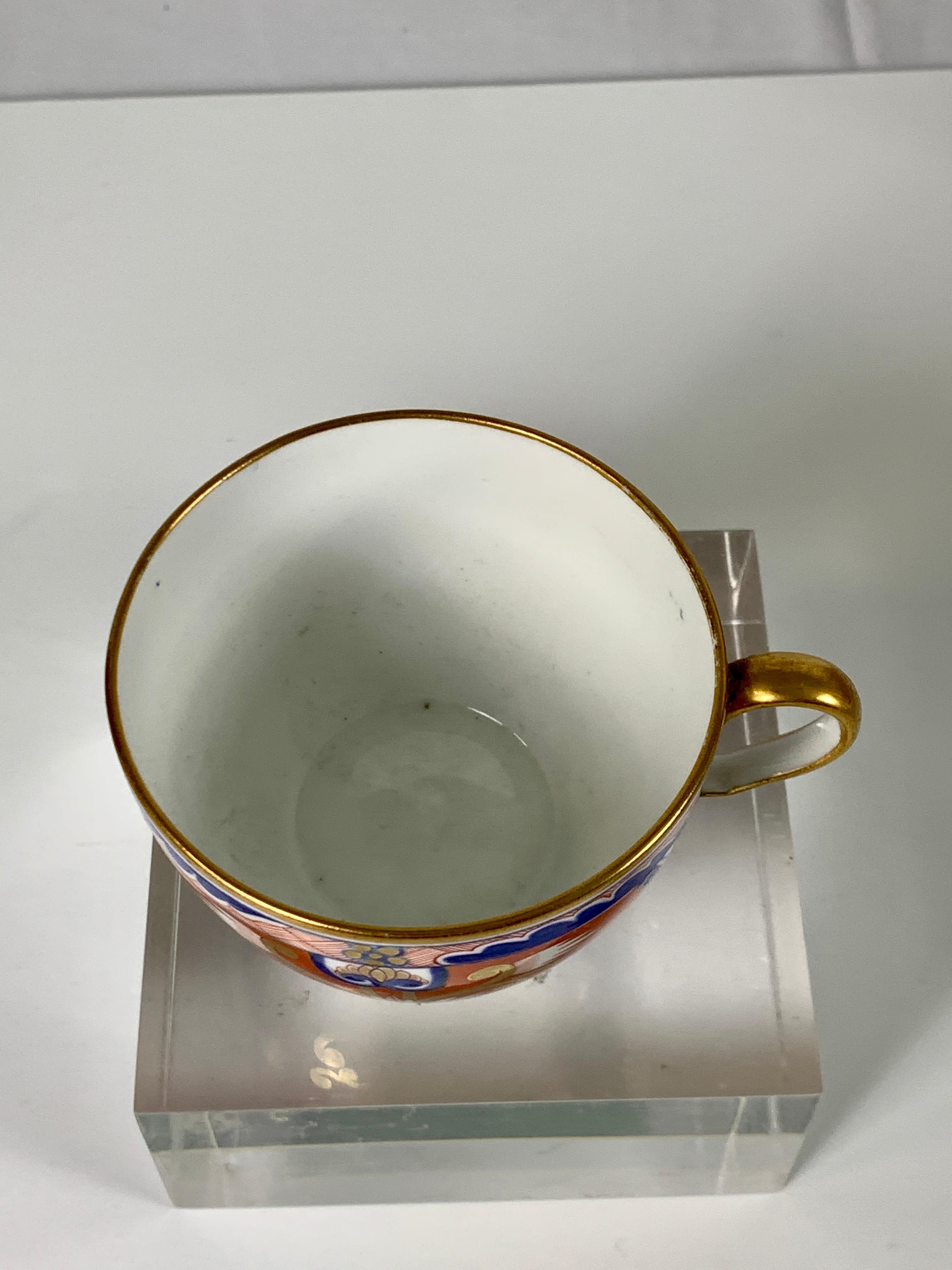 Porcelain Pair of Dollar Pattern Cups and Saucers