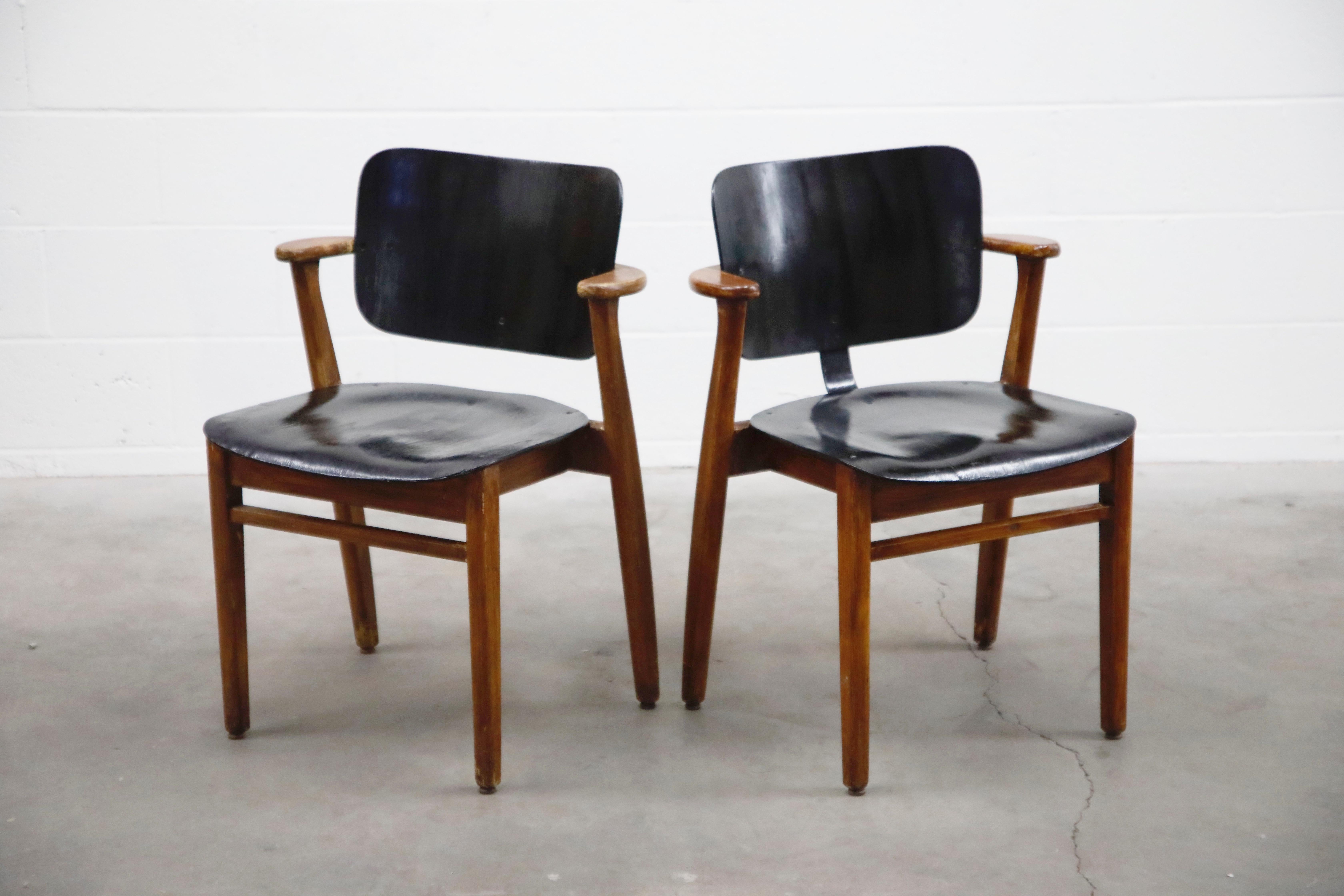 This incredible pair of Ilmari Tapiovaara 'Domus' armchairs (also called The Finn Chair in the US) was made in Finland, circa 1947, and very collectible and a fantastic example of early Mid-Century Modern design. Tapiovaara created this design for