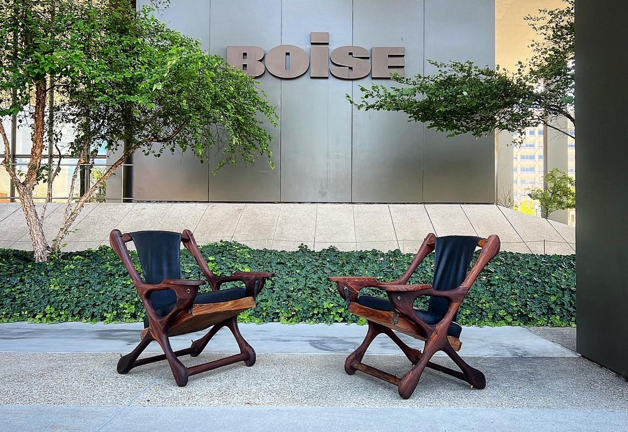 stunning pair of rosewwod lounge chairs by don shoemaker 
these do swing and so why they are called the swinger chairs 
super unique and beautiful design 

new leather 