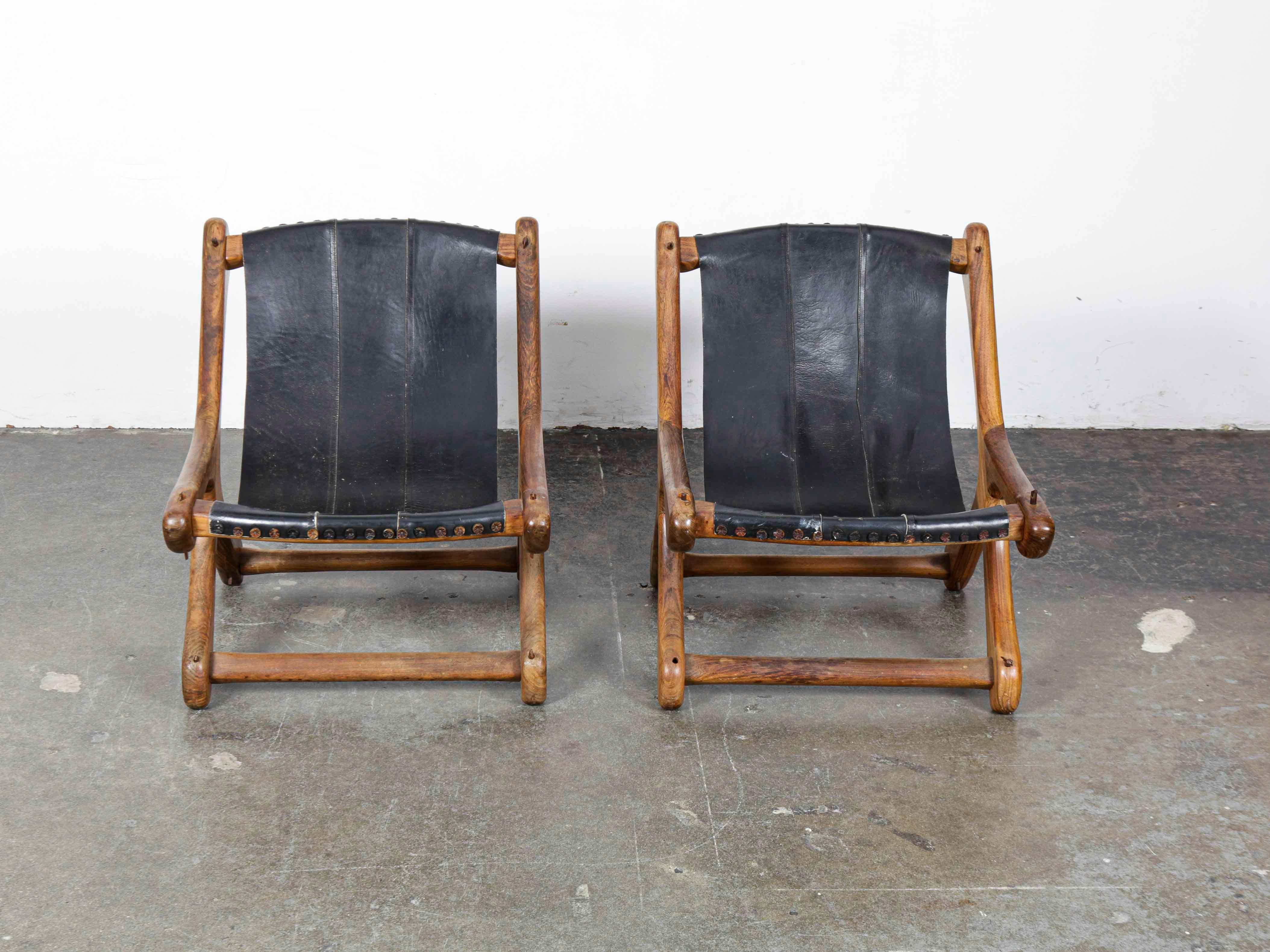 Pair of solid rosewood sling style chairs with original leather designed by Don Shoemaker for Señal S.A., Mexico, 1960s.