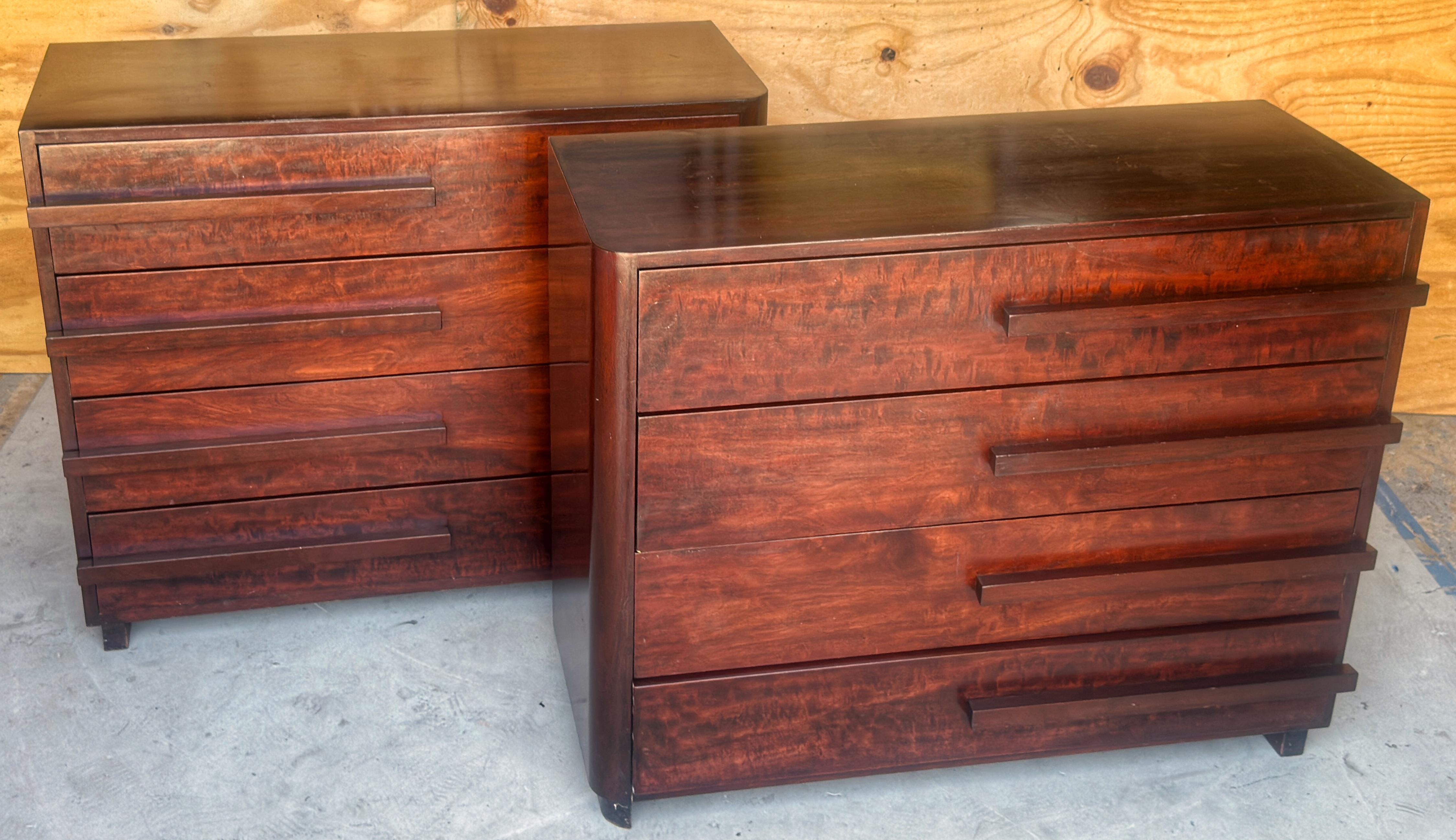 Pair of Donald Deskey Streamlined Art Deco Chests, USA, Circa 1930s

A striking matched pair of Art Deco chests are iconic examples of the streamlined modern aesthetic championed by Donald Deskey. Crafted in richly figured mahogany, retaining the