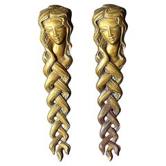 Pair of Door Handles in the form of a Woman's Face with Braided Hair