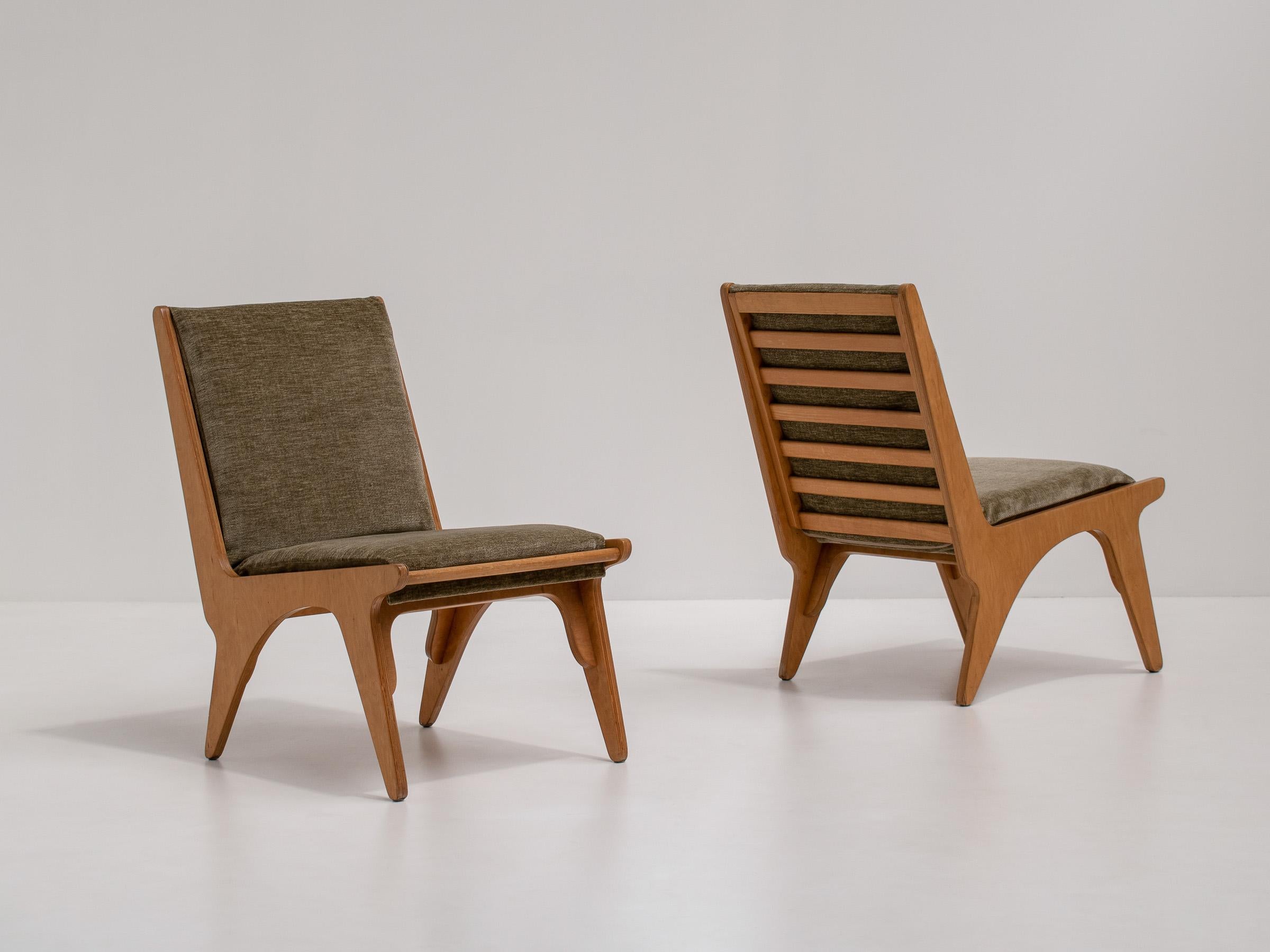 Dordrecht Chairs by Wim van Gelderen for 't Spectrum, the Netherlands.

Naive, modernist, vintage armchairs in a light-colored oak. They pair beautifully with the 
