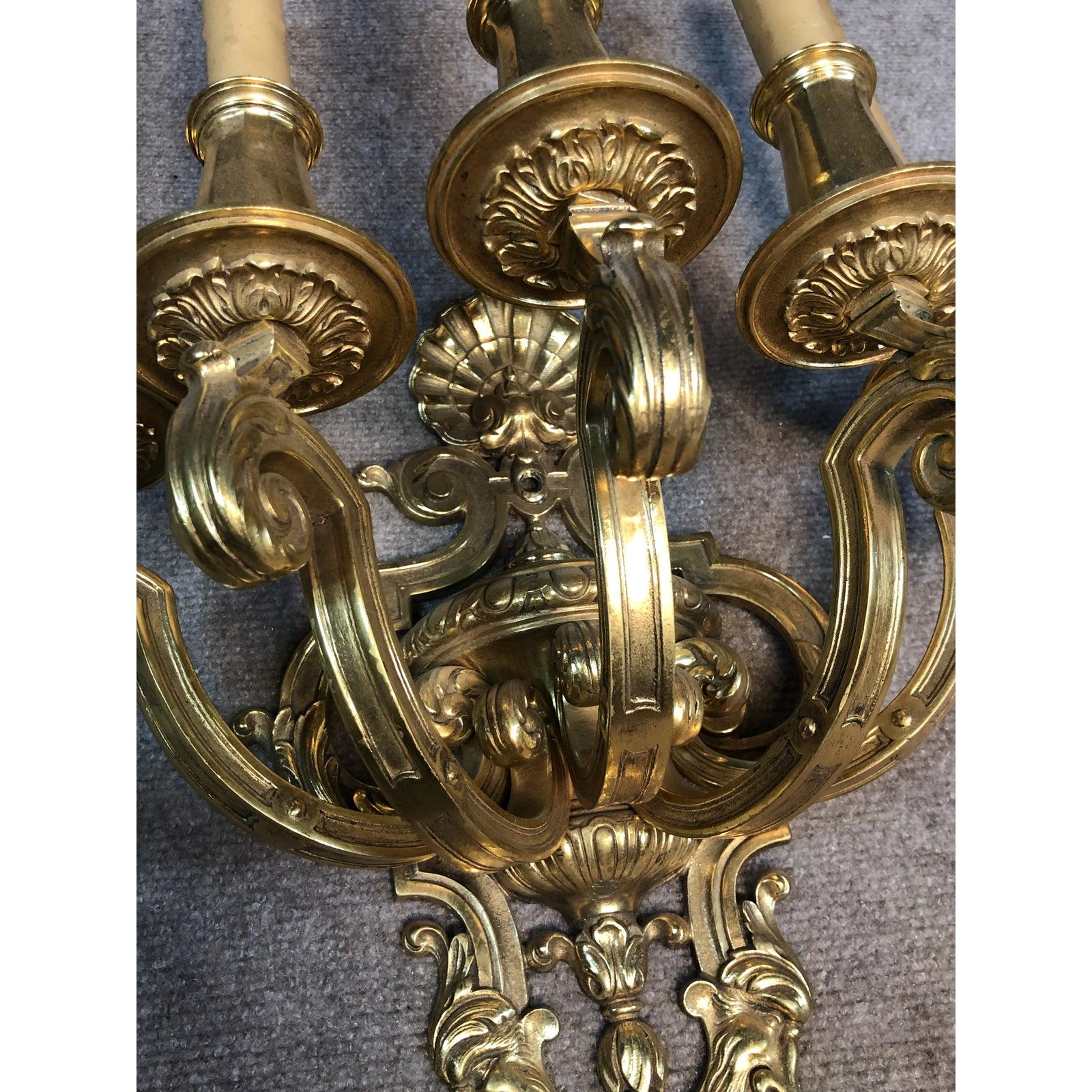 Pair of Antique Renaissance Revival doré bronze wall sconces with shell motif doré.  5-arm wall sconces adorned with grotesque faces and shell form top.