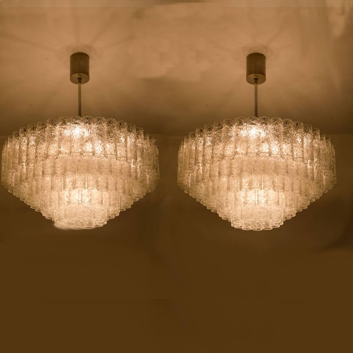 A pair of giant ballroom tube chandeliers by Doria Leuchten from the 1960s. Minimalistic design executed with a taste for excellence in craftsmanship. The chandeliers are not only functional as light source but also as a sculptural component. The