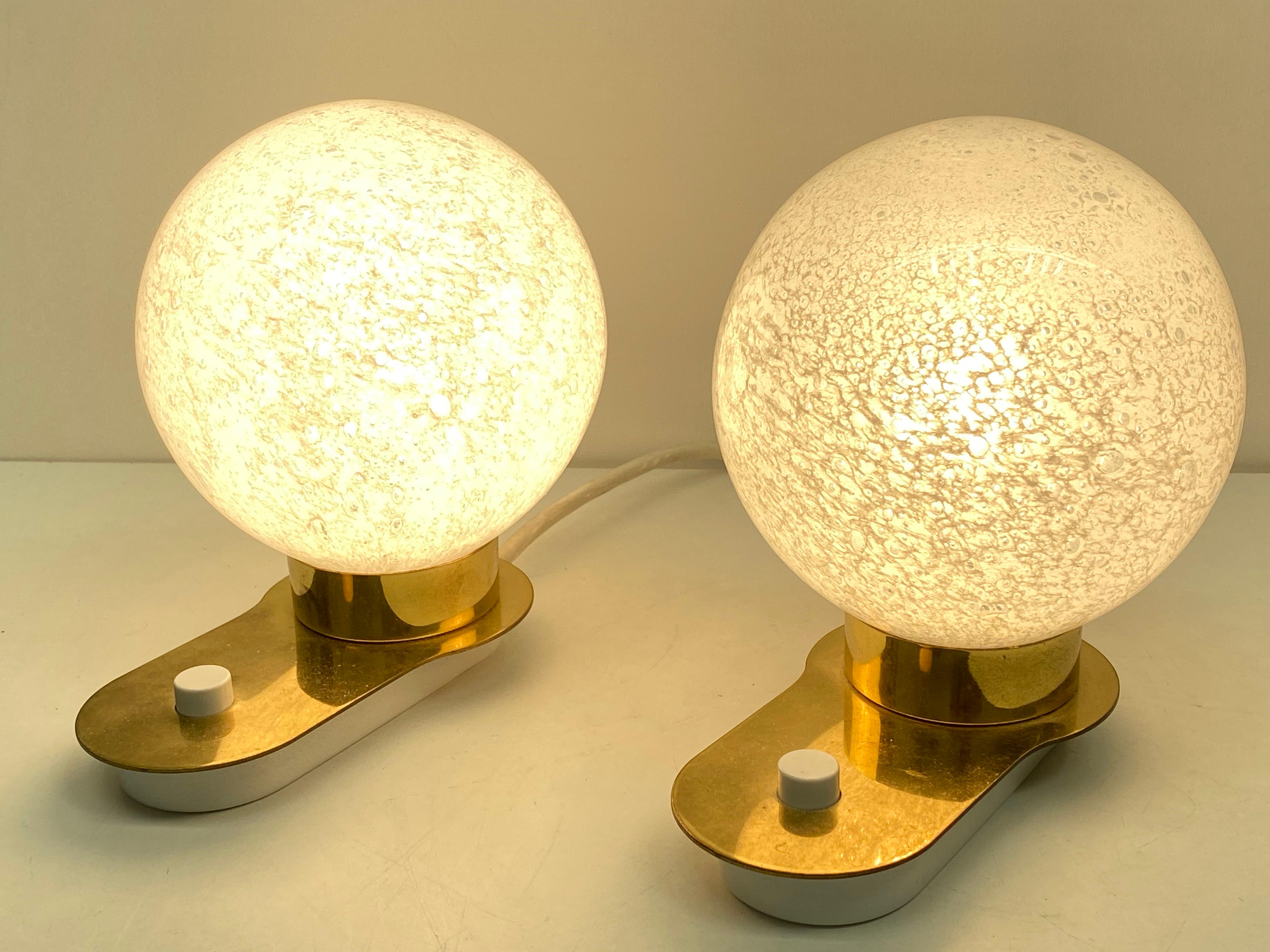 Petite pair of midcentury Doria table lamps. Each one requires one European E14 / 110 Volt Torpedo bulb, up to 60 watts. They are ready to work in the USA.

  