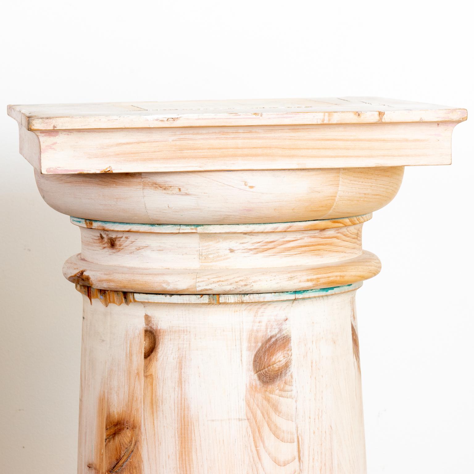 Pair of Doric columns in a pickled finish. Please note of wear consistent with age including finish loss and paint loss.
