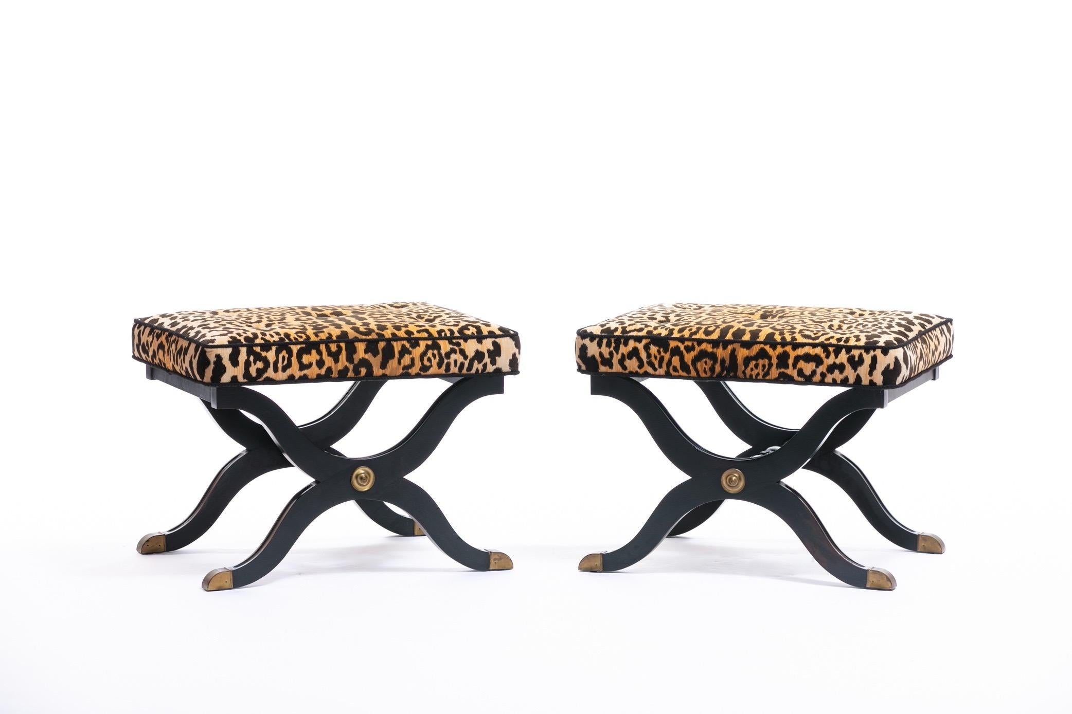 Perfection. Stately and elegant x shape and lines. Brass feet and emblem details. Soft Leopard velvet seat with black tufting and piping detail. These iconic Dorothy Draper stools are timeless. They can be re-imagined in so many ways. It's the type